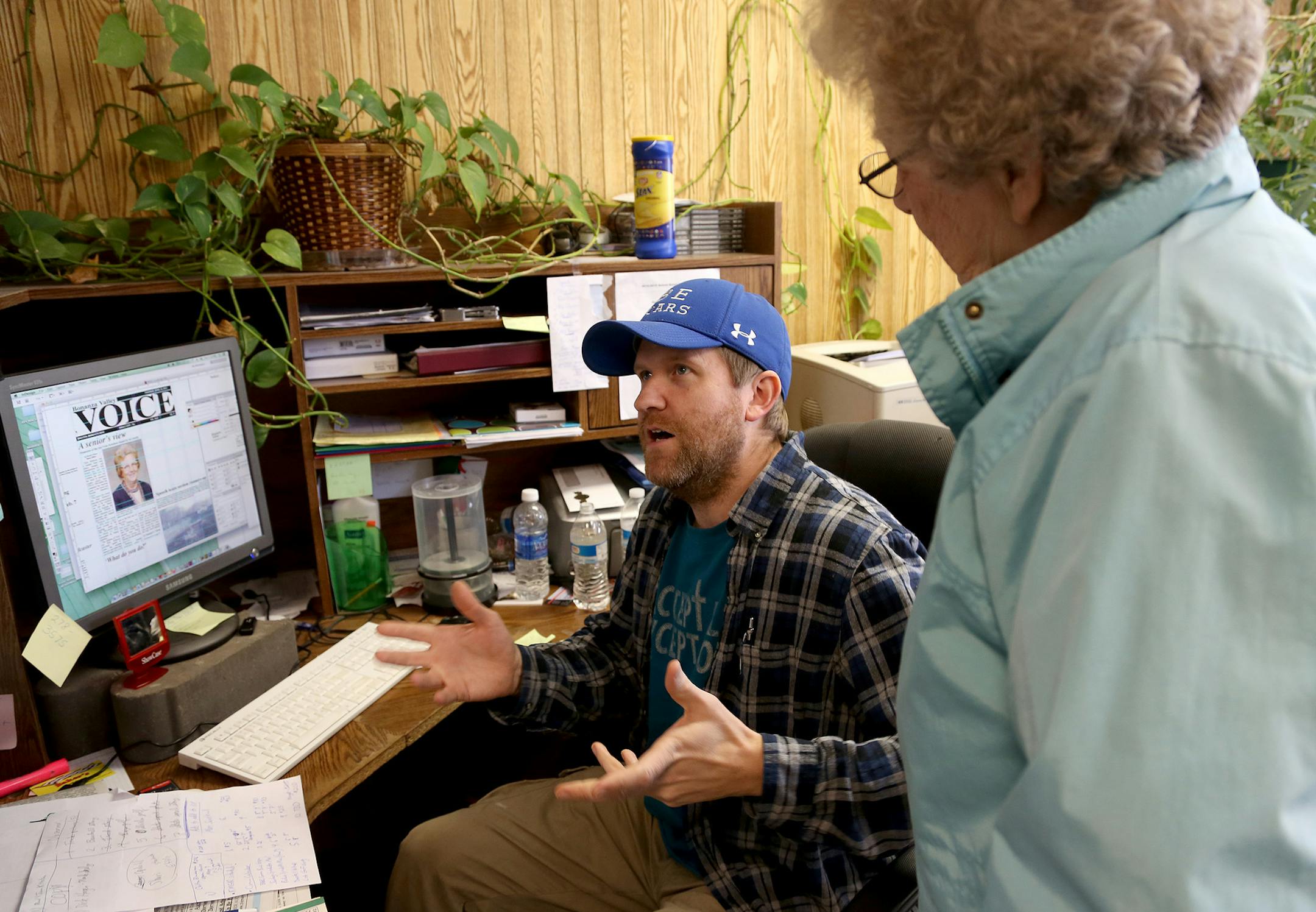 Randy Olson went over the details in an article about Viola Kittelson with her daughter, Emelie Sorenson. Kittelson, who was a teacher in the area from 1930-1976, had just passed away. ] (KYNDELL HARKNESS/STAR TRIBUNE) kyndell.harkness@startribune.com Randy Olson owner and sole operator of the Bonzana Valley Voice in Brooten Min., Tuesday, April 21, 2015.