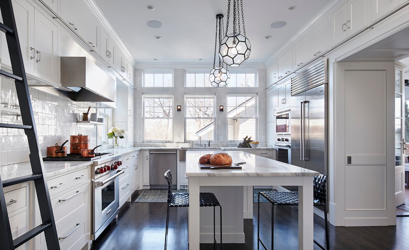 Somia Mourad and Keith Bush prefer the sleek, clean look of white enamaled woodwork and painted their 1891 Kenwood home to suit their tastes. Project Team: Albertsson Hansen Architecture, Ltd., Todd Hansen, AIA, CID and Ian McLellan, Assoc. AIA Photo Credit: Corey Gaffer, © Gaffer Photography