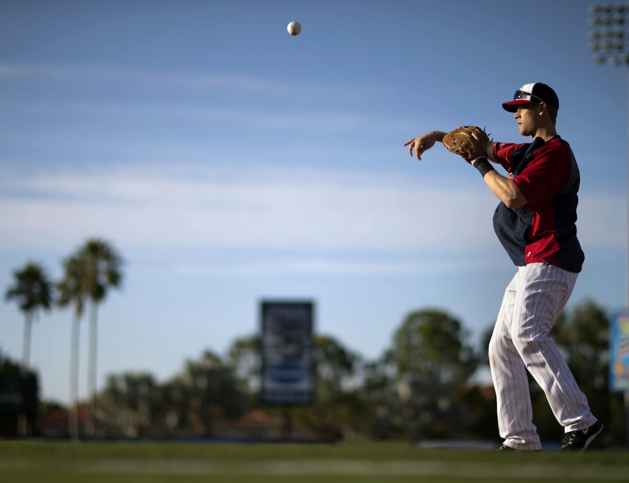 Minnesota Twins' Justin Morneau warms up before a spring training exhibition baseball game against the Baltimore Orioles, Wednesday, March 13, 2013, in Fort Myers, Fla. (AP Photo/David Goldman) ORG XMIT: MIN2013031416543209