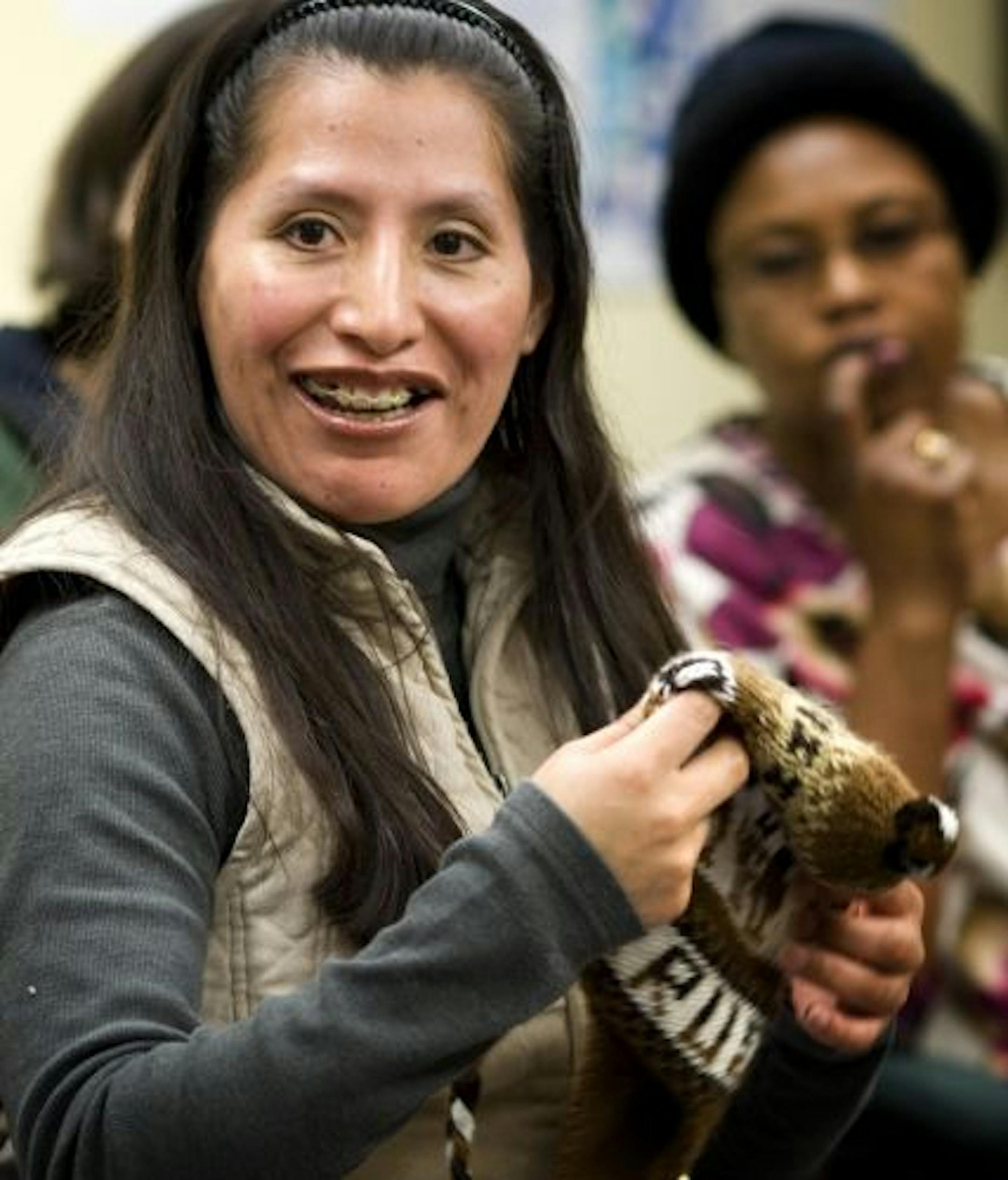 Bernardina Lopez showed a hat from her native country Peru at Neighborhood House in St. Paul. English language students were asked to bring in something that represents their country of origin and share it with the class.