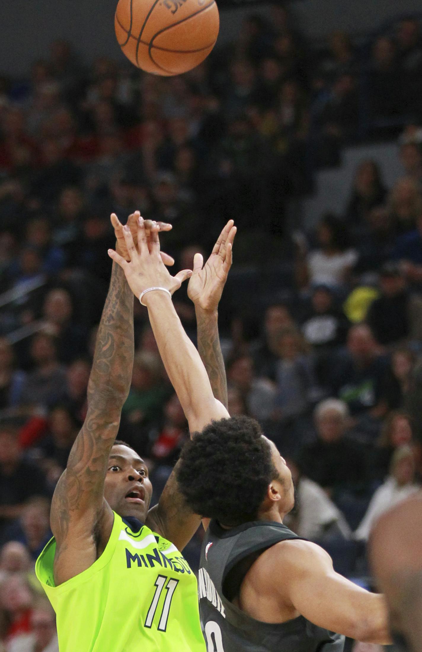 Minnesota Timberwolves guard Jamal Crawford (11) shoots over Brooklyn Nets guard Allen Crabbe (8) during the fourth quarter of an NBA basketball game Saturday, Jan. 27, 2018, in Minneapolis. The Timberwolves defeated the Nets 111-97. (AP Photo/Andy Clayton-King)