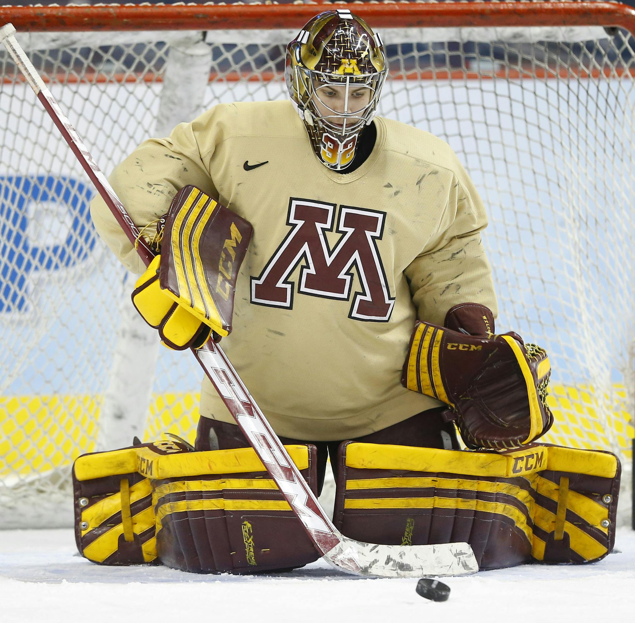 Minnesota's Adam Wilcox defends the goal during team practice for the NCAA men's college hockey Frozen Four tournament Wednesday, April 9, 2014, in Philadelphia. Minnesota faces North Dakota in a semifinal match on Thursday. (AP Photo/Matt Rourke)