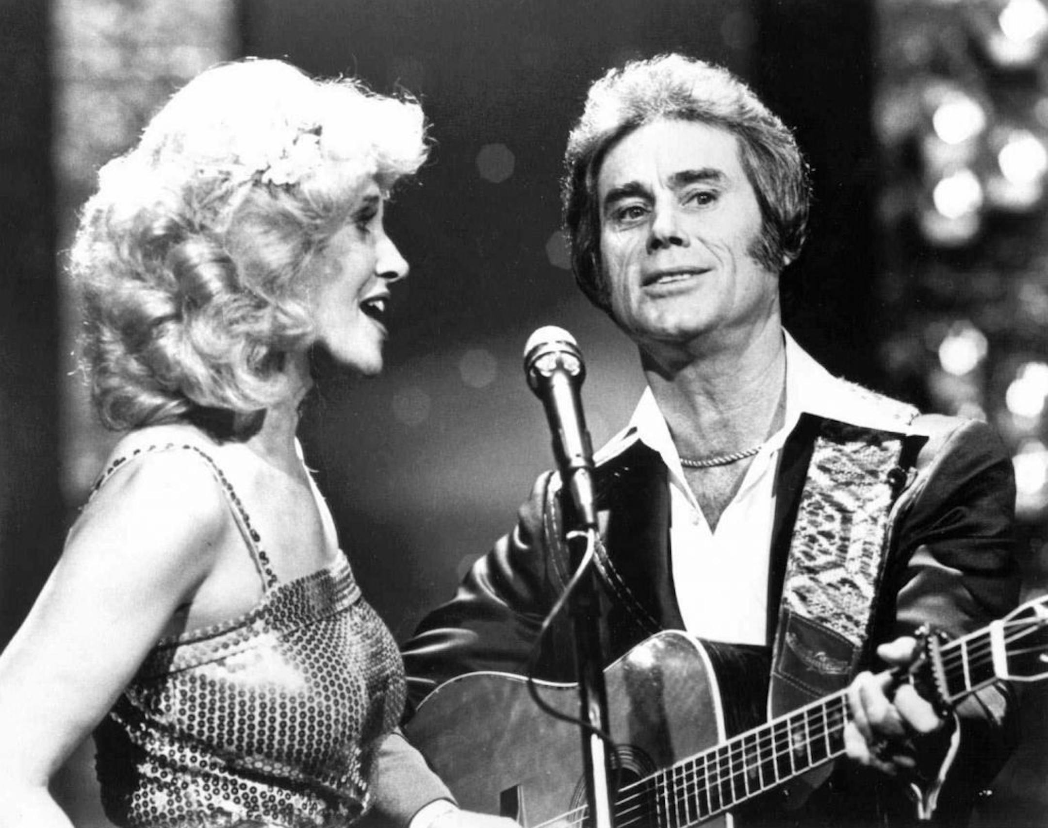 FILE--Tammy Wynette, left, sings with George Jones in an undated file picture. Jones was one of Wynette's five husbands and a frequent singing partner. Wynette, whose hits included the classic country music ode "Stand by Your Man," died Monday April 6, 1998, at age 55, while napping at her Nashville, Tenn., home. The cause of her death was believed to be a blood clot, spokeswoman Evelyn Shriver said. Wynette had had a series of health problems in recent years.