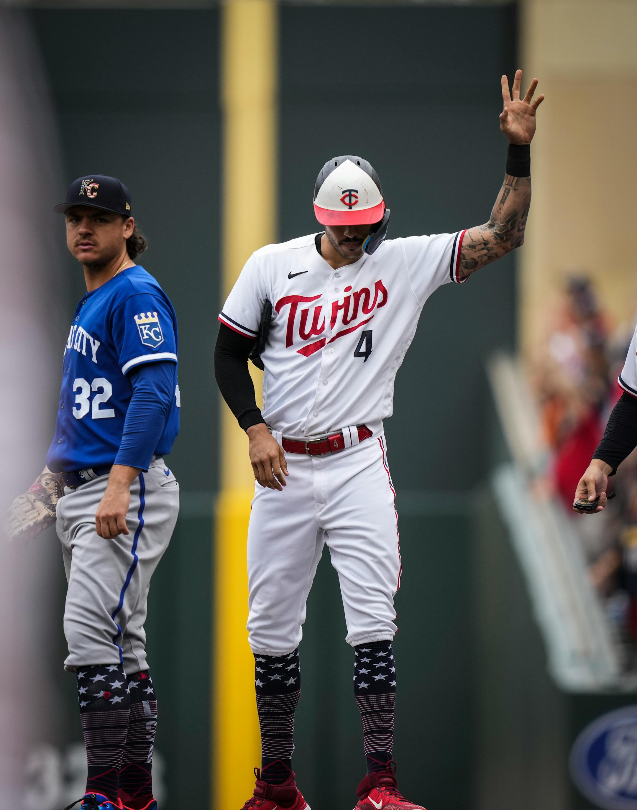 Minnesota Twins shortstop Carlos Correa (4) waves to the crowd after getting his 1000th career hit in the third inning.