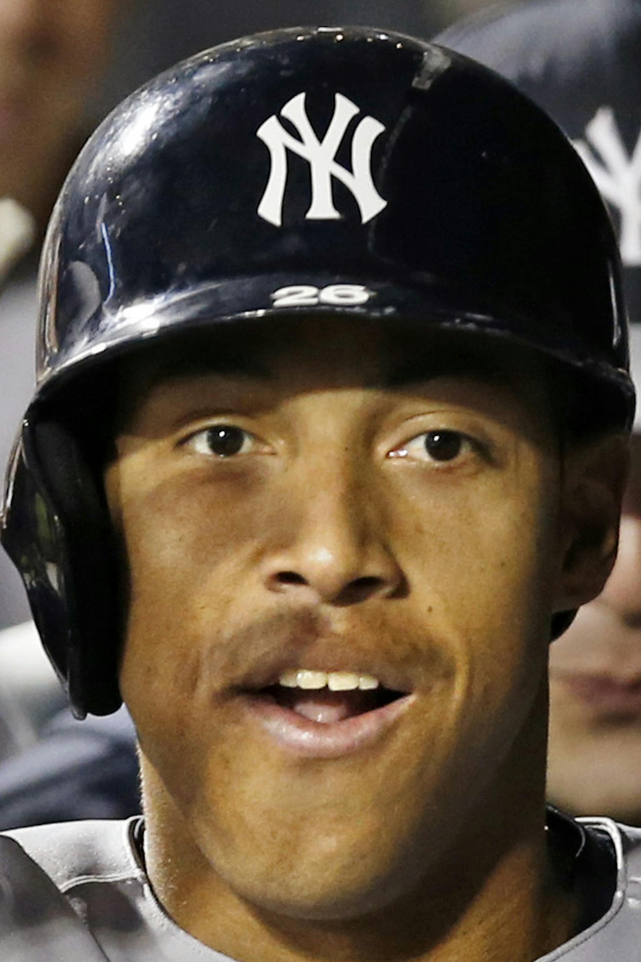 Teammates congratulate New York Yankees Yangervis Solarte after his fourth-inning solo home run off New York Mets starting pitcher Rafael Montero in a baseball game in New York, Wednesday, May 14, 2014. (AP Photo)