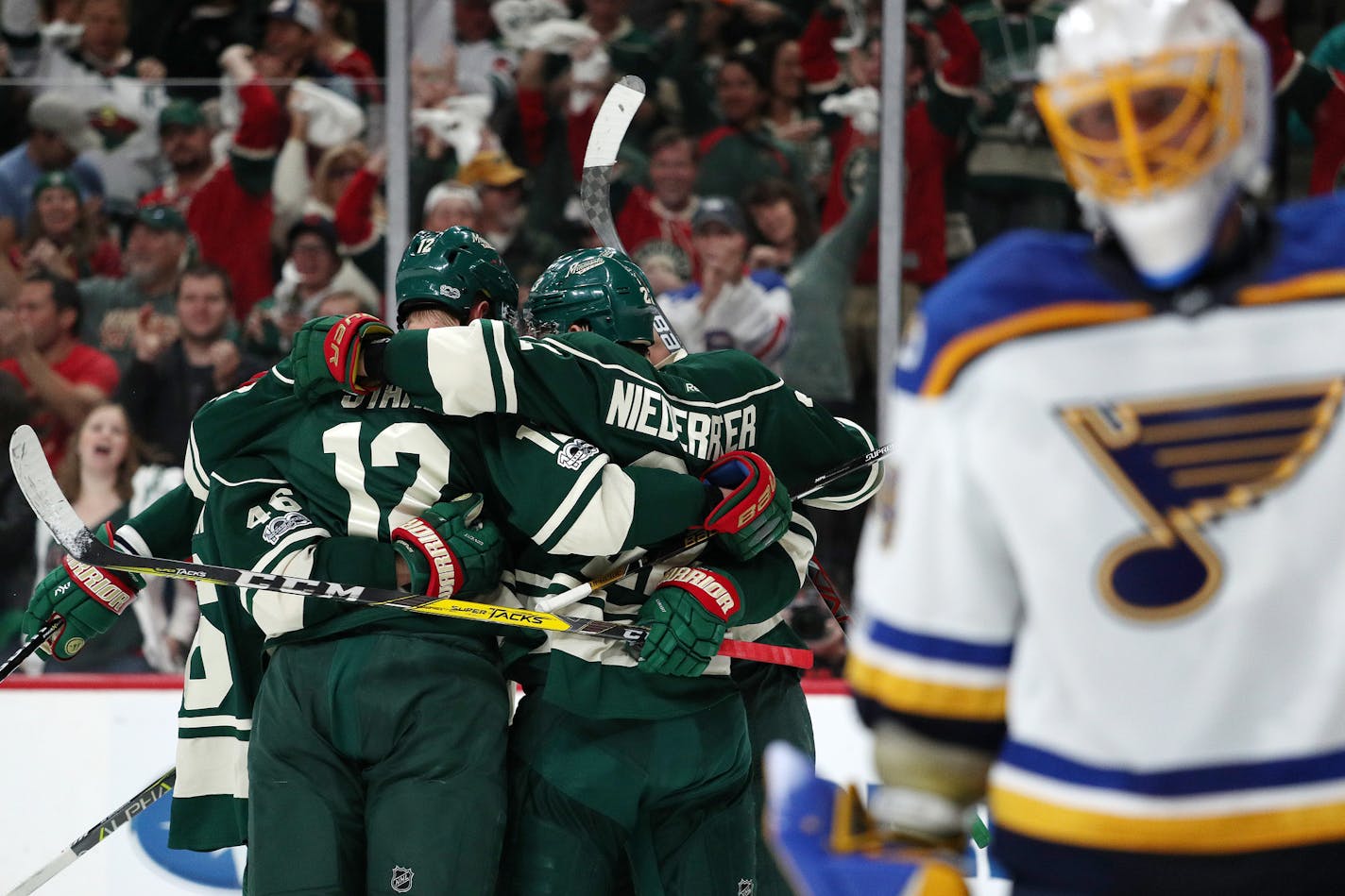 The Minnesota Wild celebrate their first goal of the game in the first period. ] ANTHONY SOUFFLE &#xef; anthony.souffle@startribune.com Game action from a National Hockey League (NHL) playoff game 5 between the Minnesota Wild and the St. Louis Blues Saturday, April 22, 2017 at the Xcel Energy Center in St. Paul, Minn.