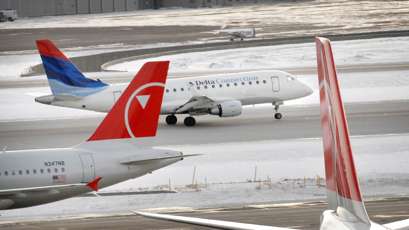 Northwest and Delta Connection jets on the tarmac at Minneapolis-St. Paul International Airport.