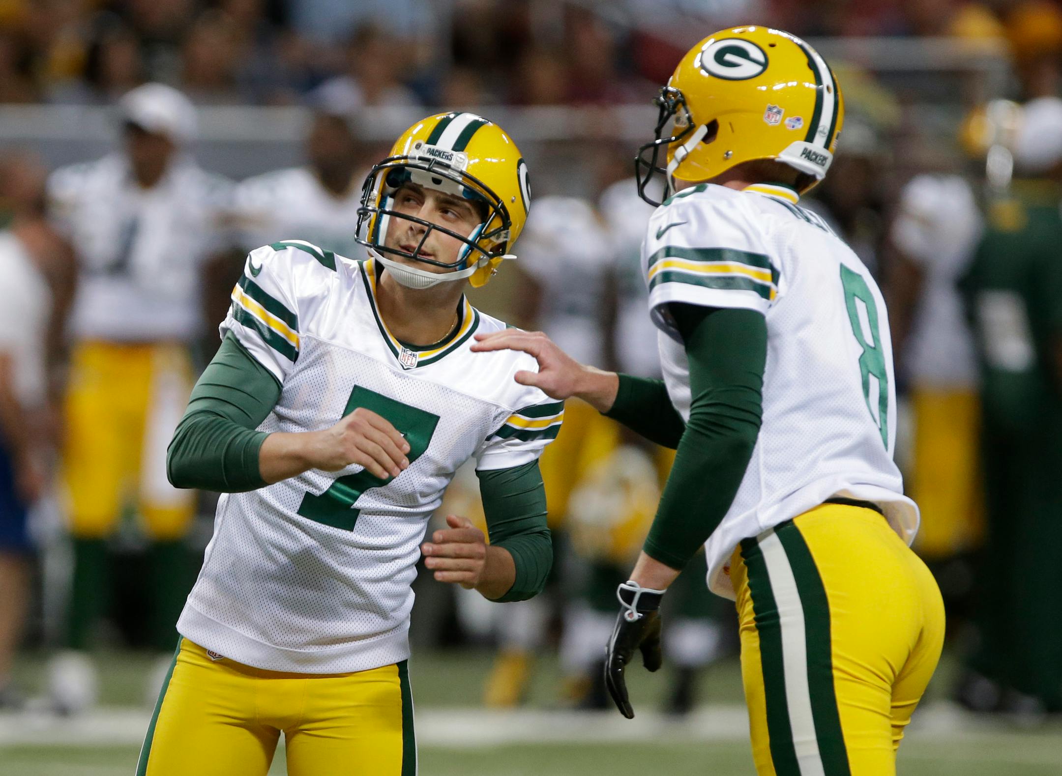 Green Bay Packers kicker Giorgio Tavecchio, left, was congratulated by Tim Masthay after kicking a 38-yard field goal against St. Louis on Aug. 17. Tavecchio is trying to unseat Mason Crosby as the Packers' kicker.