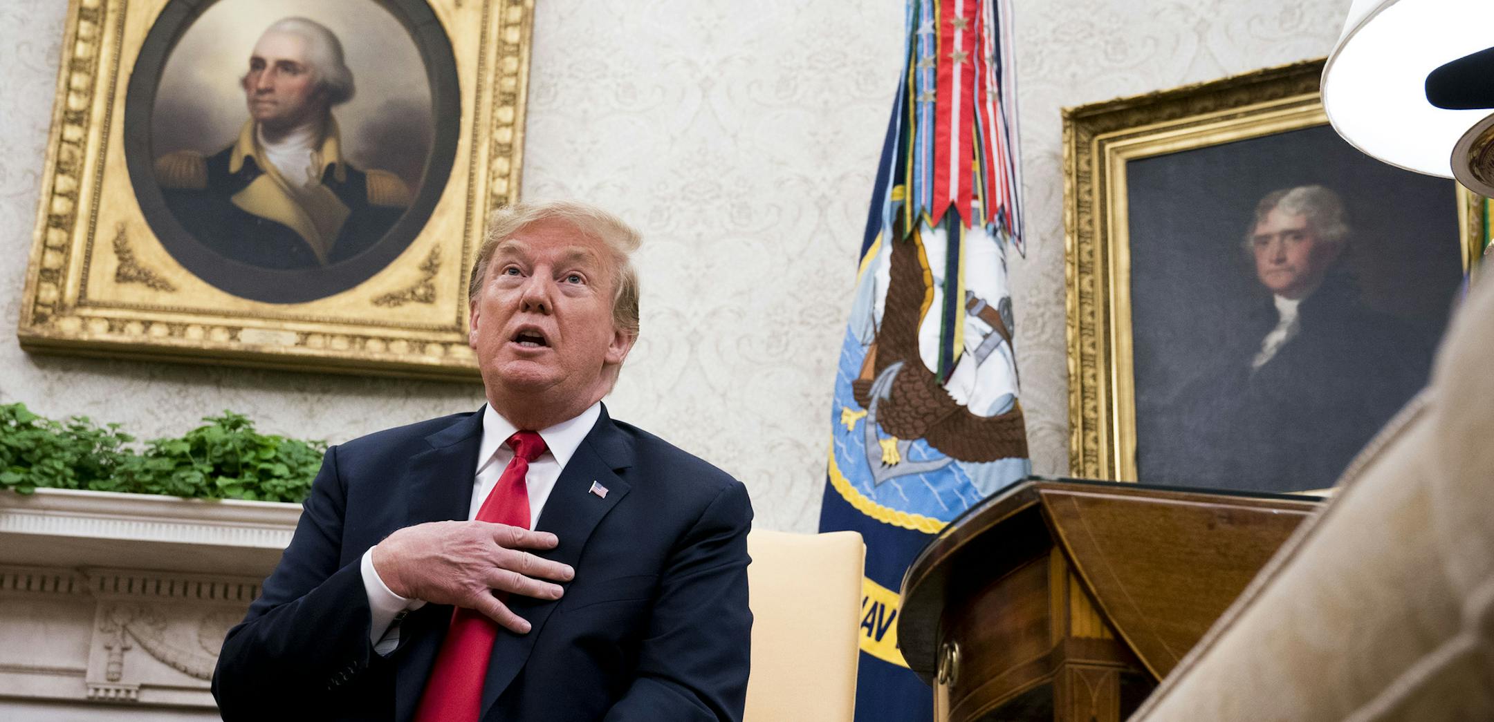President Donald Trump marks remarks about the news that Justice Anthony Kennedy announced that he would retire, during a meeting with President of the Portuguese Republic Marcelo Rebelo de Sousa in the Oval Office of the White House, June 27, 2018. His retirement gives Trump the opportunity to help create a solid five-member conservative majority. (Doug Mills/The New York Times)