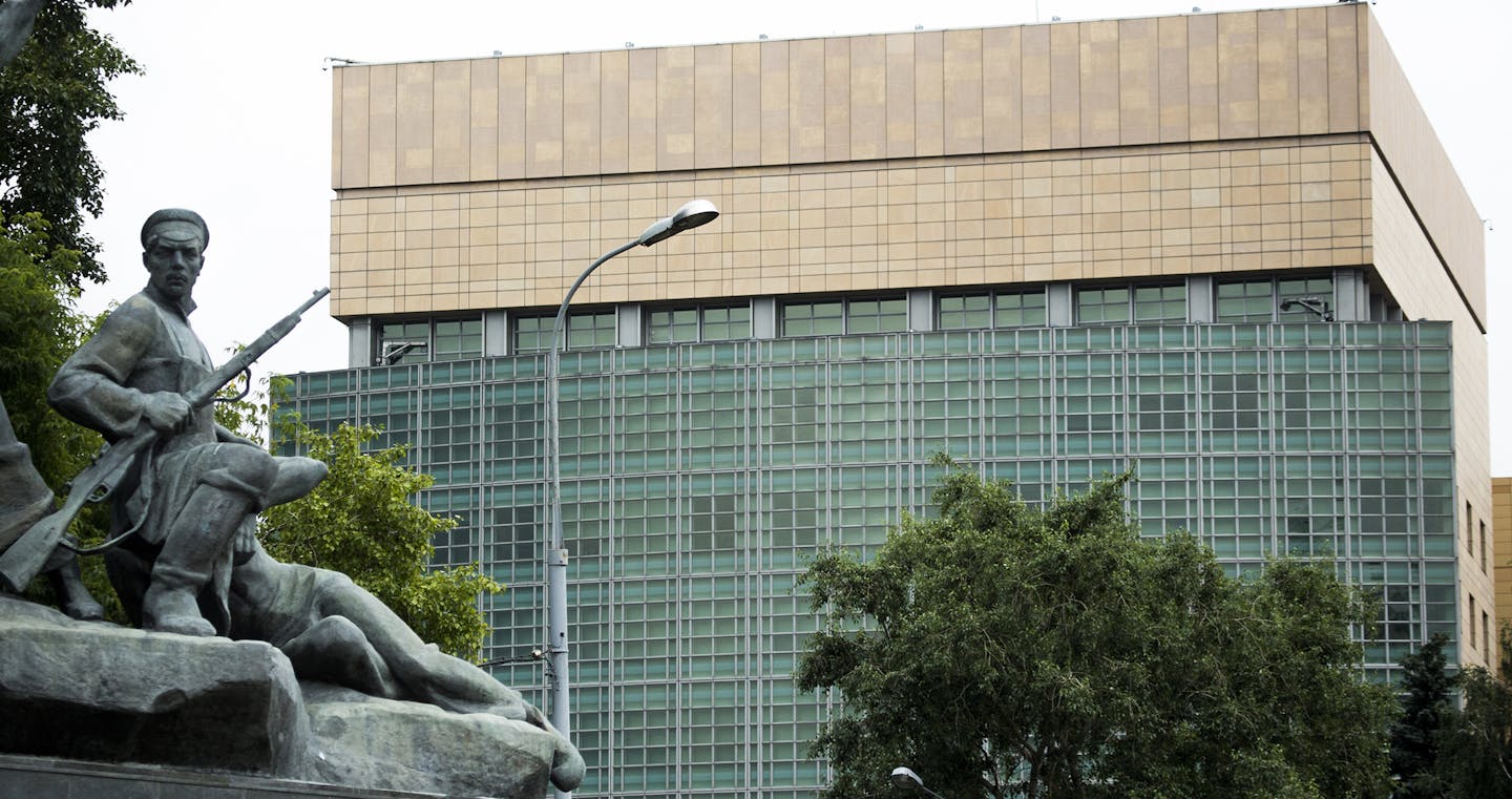 The U.S. Embassy in Moscow, with a monument to Russian revolutionary workers in the foreground Friday, July 28, 2017. Russia's Foreign Ministry on Friday ordered a reduction in the number of U.S. diplomats in Russia and said it was closing down a U.S. recreation retreat in response to fresh sanctions against Russia. (AP Photo/Alexander Zemlianichenko) ORG XMIT: MIN2017080113262111