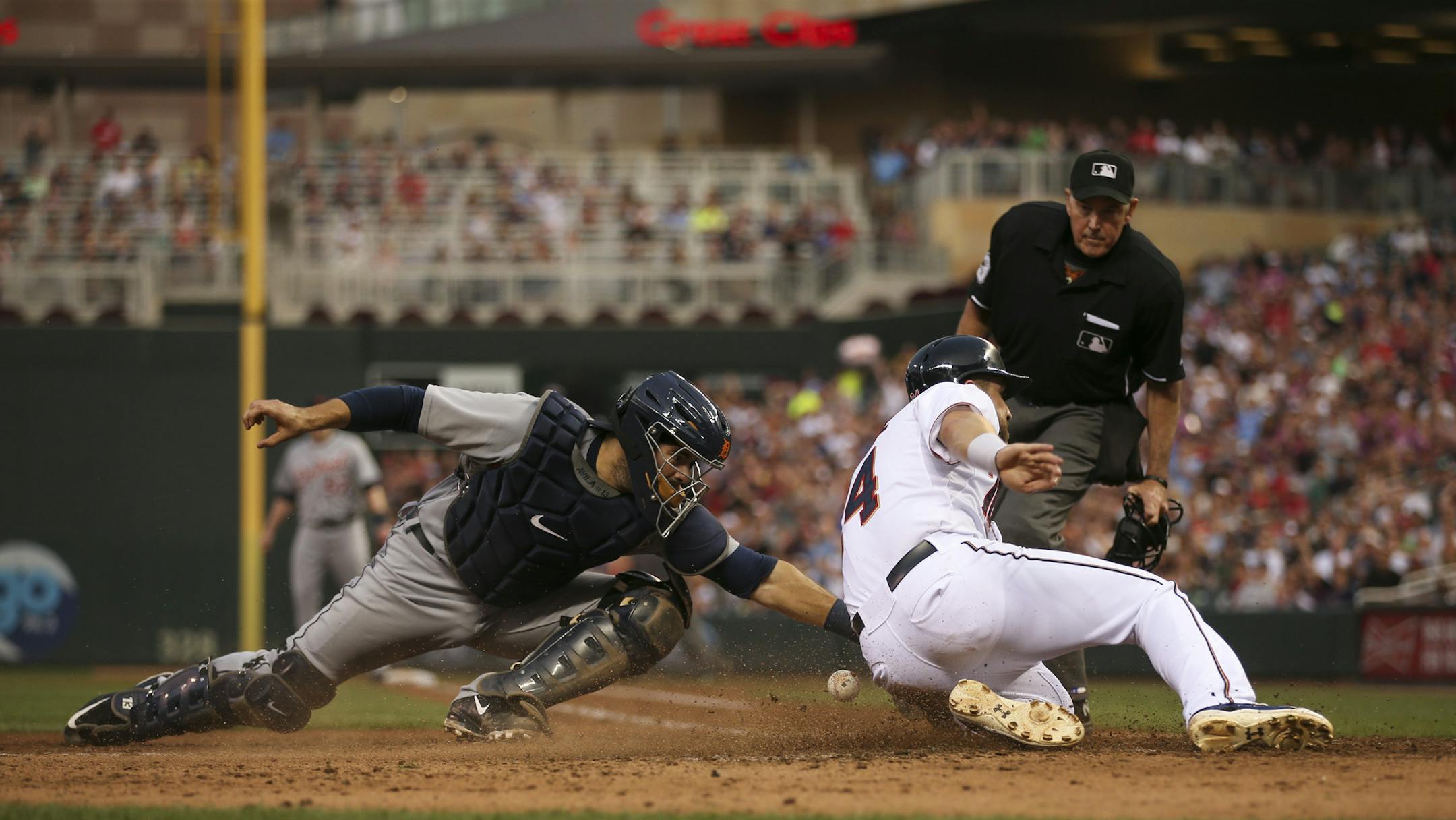 Minnesota Twins third baseman Trevor Plouffe scored the go ahead run in the fifth inning when Detroit Tigers catcher Alex Avila dropped the ball Thursday night at Target Field. JEFF WHEELER &#xef; jeff.wheeler@startribune.com The Twins began a series with the Detroit Tigers Thursday night, July 9, 2015 at Target Field in Minneapolis.