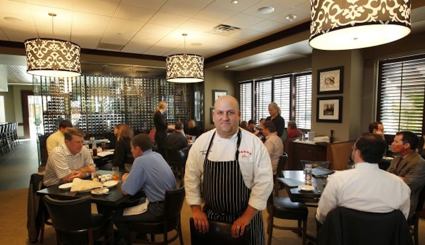 Chef Mike Dalton in the dining room at Parma 8200.