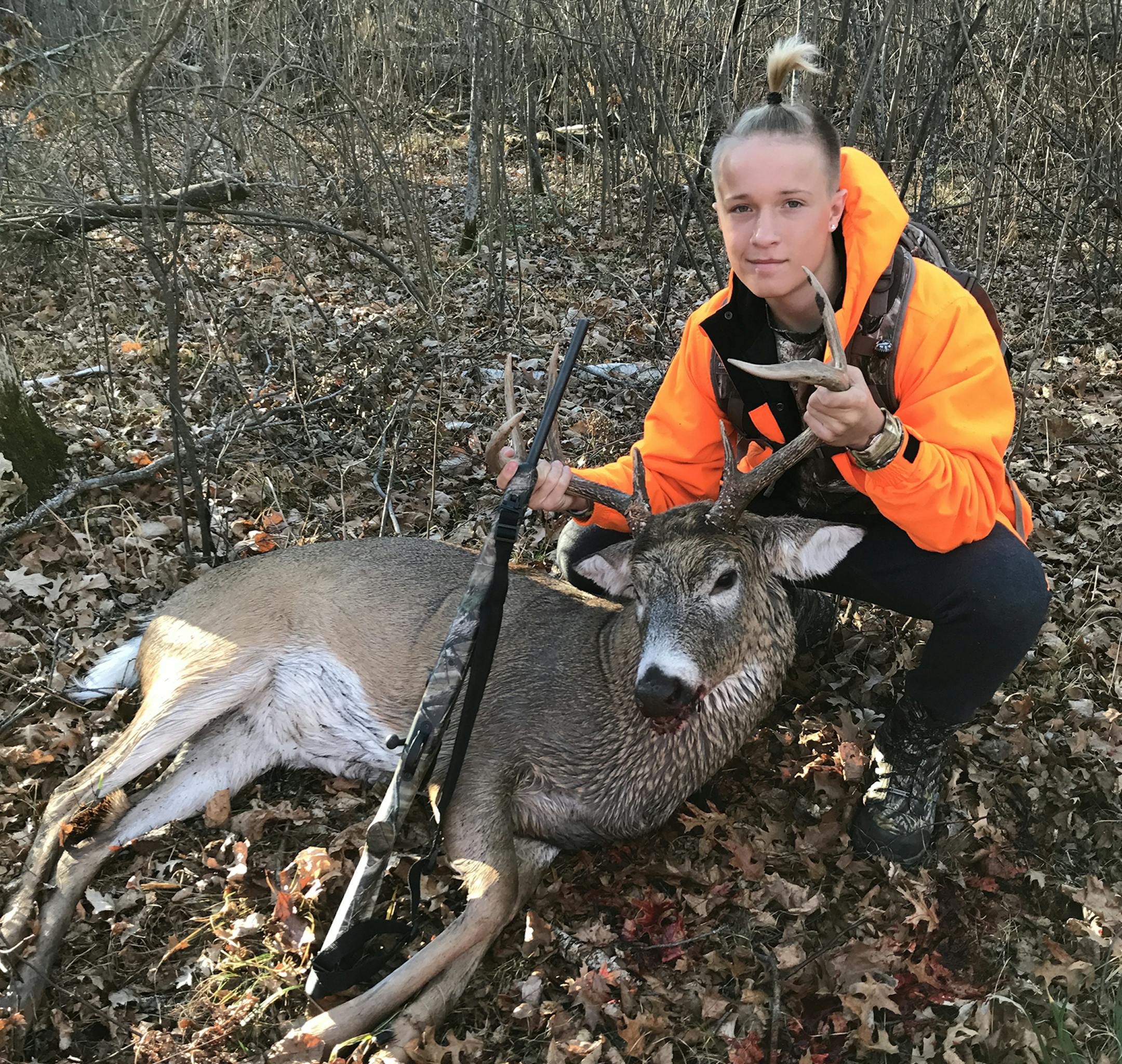 Tradition goes on: Jake Larson, 15, was born in Minnesota but now lives in Tampa, Fla. He returned north this year with his dad, Mike, to continue a family deer hunting tradition in Minnesota.