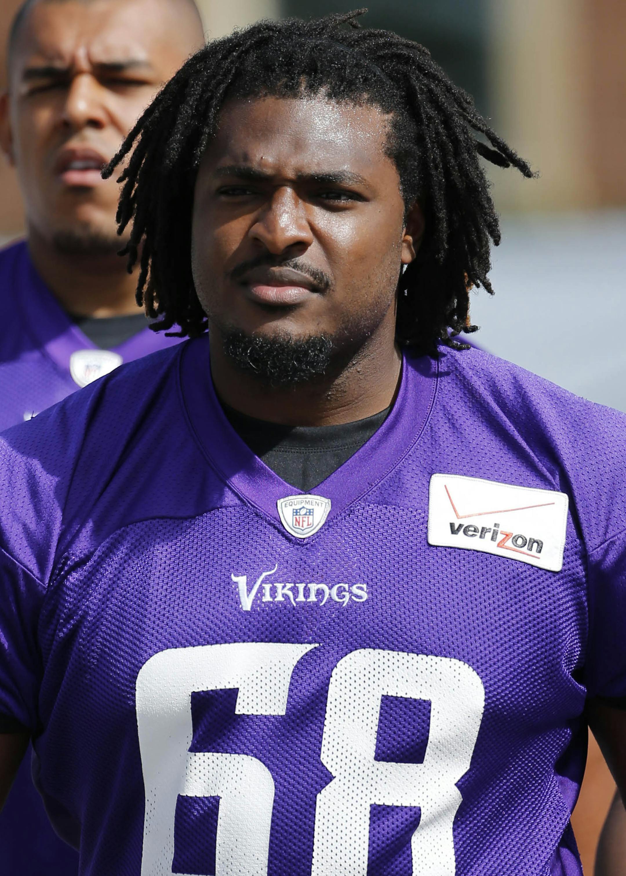 Minnesota Vikings offensive tackle T.J. Clemmings walks to the practice fields at an NFL football training camp on the campus of Minnesota State University Sunday, July 26, 2015, in Mankato, Minn. (AP Photo/Charles Rex Arbogast)