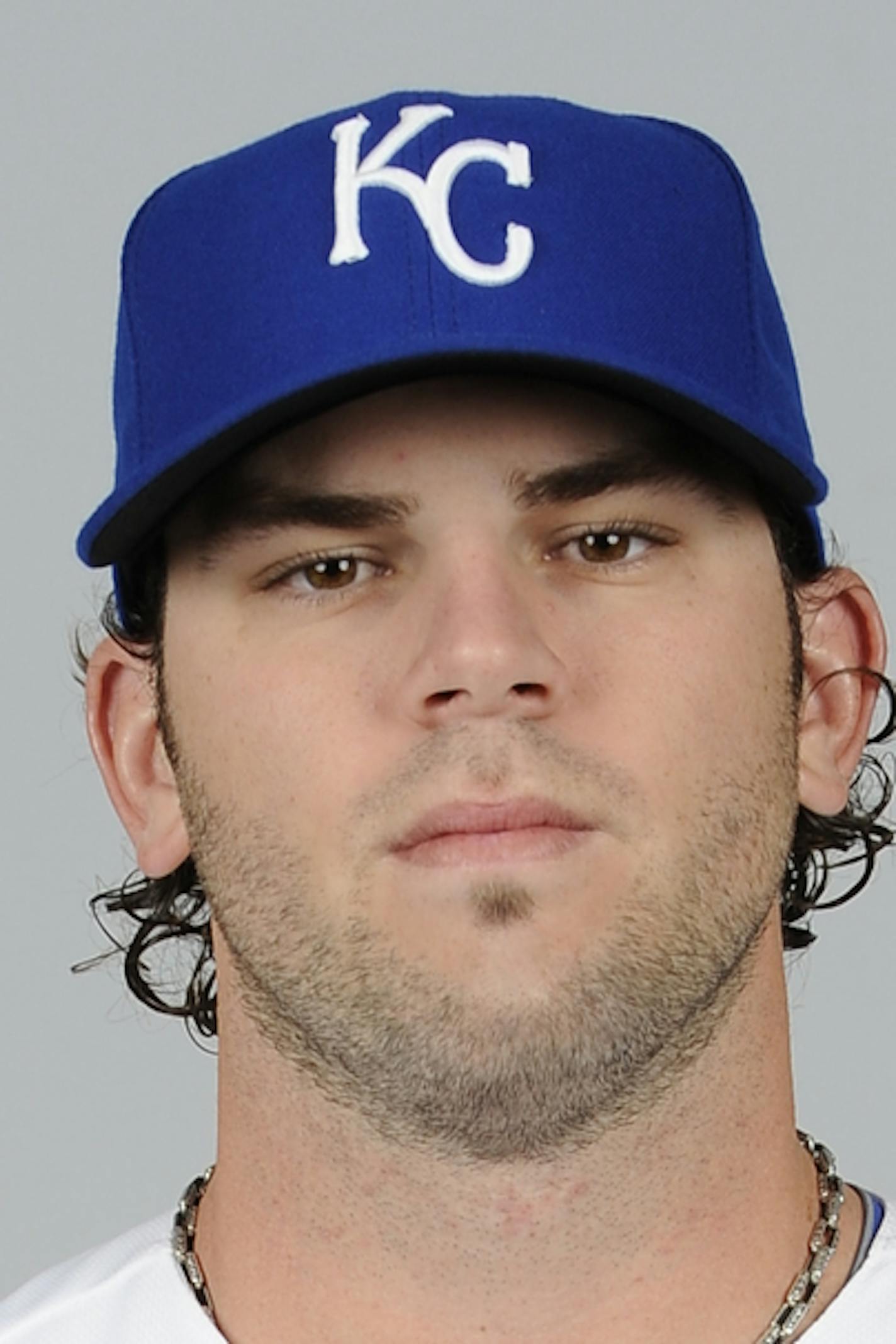 SURPRISE, AZ - FEBRUARY 21: Mike Moustakas #8 of the Kansas City Royals poses during Photo Day on Thursday, February 21, 2013 at Surprise Stadium in Surprise, Arizona. (Photo by Chris Bernacchi/MLB Photos via Getty Images) *** Local Caption *** Mike Moustakas ORG XMIT: 159449626