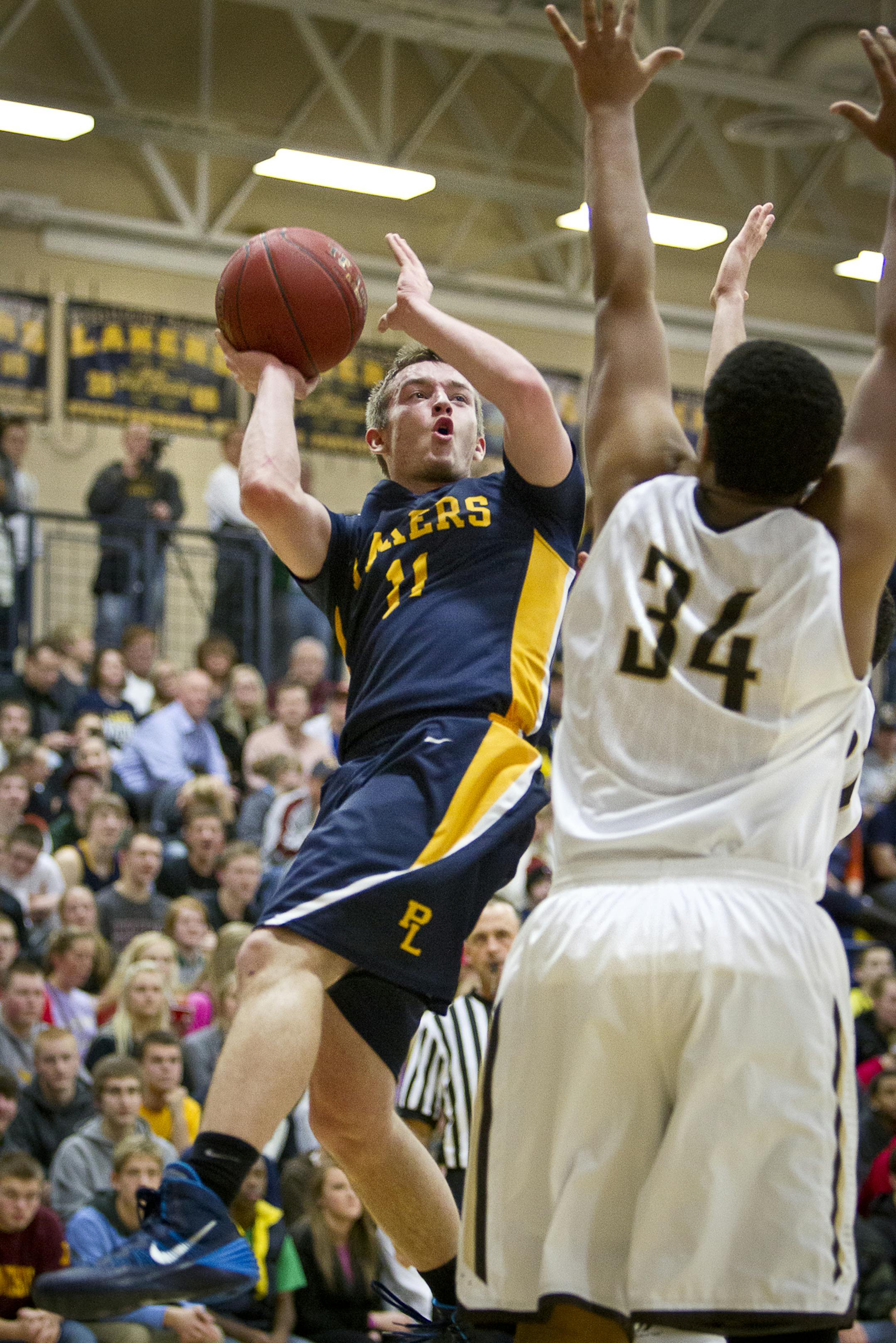 Prior Lake guard Jon Sobaski (11) is fouled mid-shot during the second half of the basketball game between Prior Lake and Apple Valley at Prior Lake High School, Friday, January 24, 2014. [BEN BREWER ‚Ä¢ Special to the Star Tribune Assignment # 77251 DATE: January 24, 2014 SLUG: PSOUTH012914 EXTRA INFORMATION: