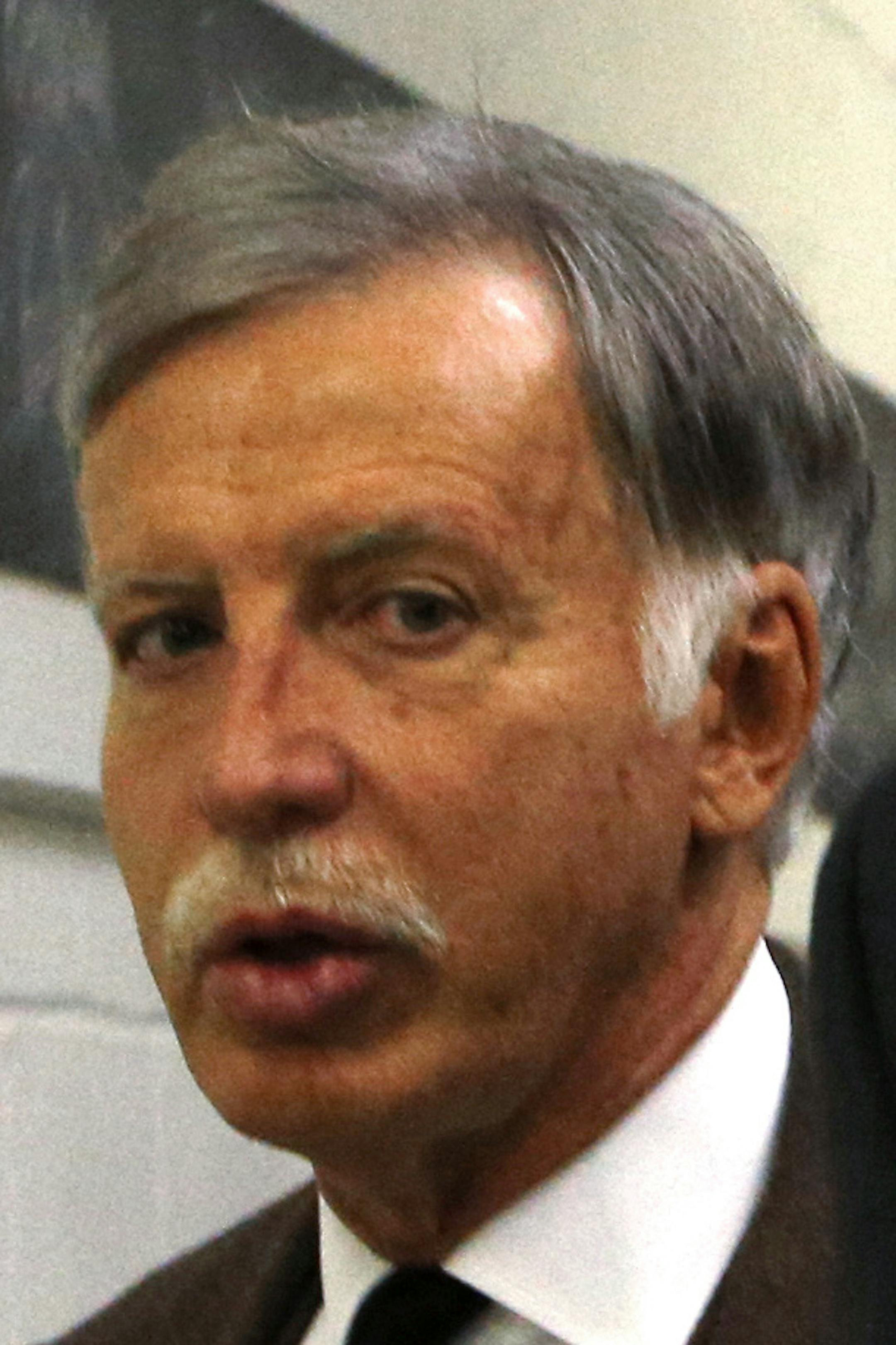 St. Louis Rams owner Stan Kroenke, left, walks out of the Edward Jones Dome with an unidentified person following an NFL football game between the Rams and the Tampa Bay Buccaneers on Thursday, Dec. 17, 2015, in St. Louis. The game could be the final home contest for the St. Louis Rams if Kroenke is allowed to move the team to Los Angeles next season. (AP Photo/Billy Hurst)