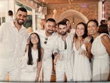 Ari Parritz, in the middle with sunglasses, celebrates his cousin’s wedding Friday in Caesarea, Israel. Hours later, Hamas launched the largest-scal