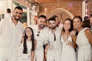 Ari Parritz, in the middle with sunglasses, celebrates his cousin’s wedding Friday in Caesarea, Israel. Hours later, Hamas launched the largest-scal