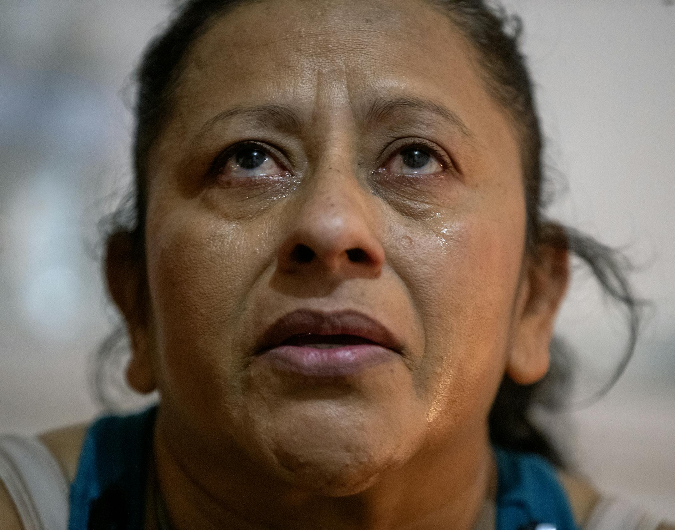 Maria Madalena cried as she described her journey escaping gang intimidation in El Salvador, working in Mexico for five years, and crossing the border in Tijuana seeking political asylum last summer, in the church basement where they are living in Montevideo, MN, Friday, January 18, 2019. ] ELIZABETH FLORES &#x2022; liz.flores@startribune.com