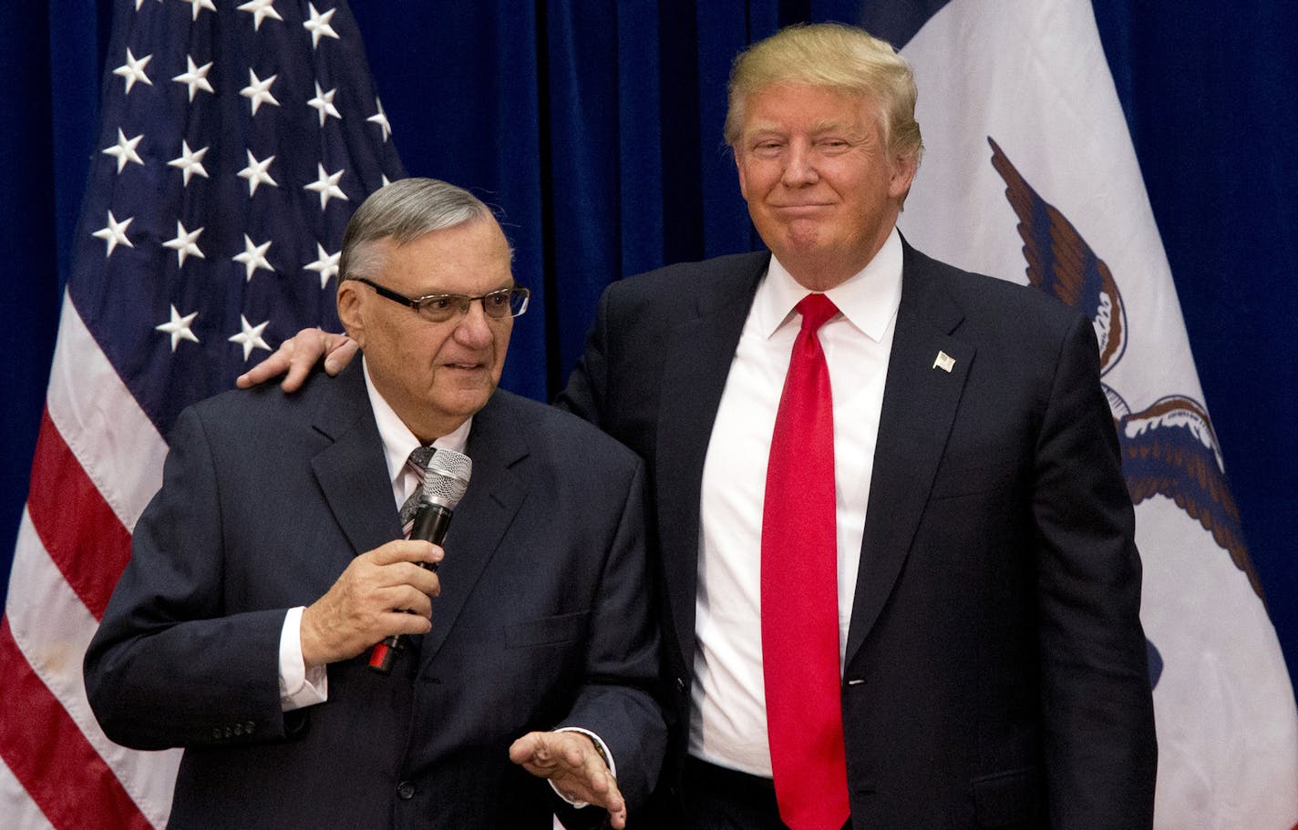 FILE - In this Jan. 26, 2016 file photo, then-Republican presidential candidate Donald Trump is joined by Joe Arpaio, the sheriff of metro Phoenix, at a campaign event in Marshalltown, Iowa. Trump was just a few weeks into his candidacy in 2015 when came to Phoenix for a speech that ended up being a bigger moment in his campaign than most people realized at the time. And now Trump is coming back to Arizona at another crucial moment in his presidency. (AP Photo/Mary Altaffer, File) ORG XMIT: MIN2