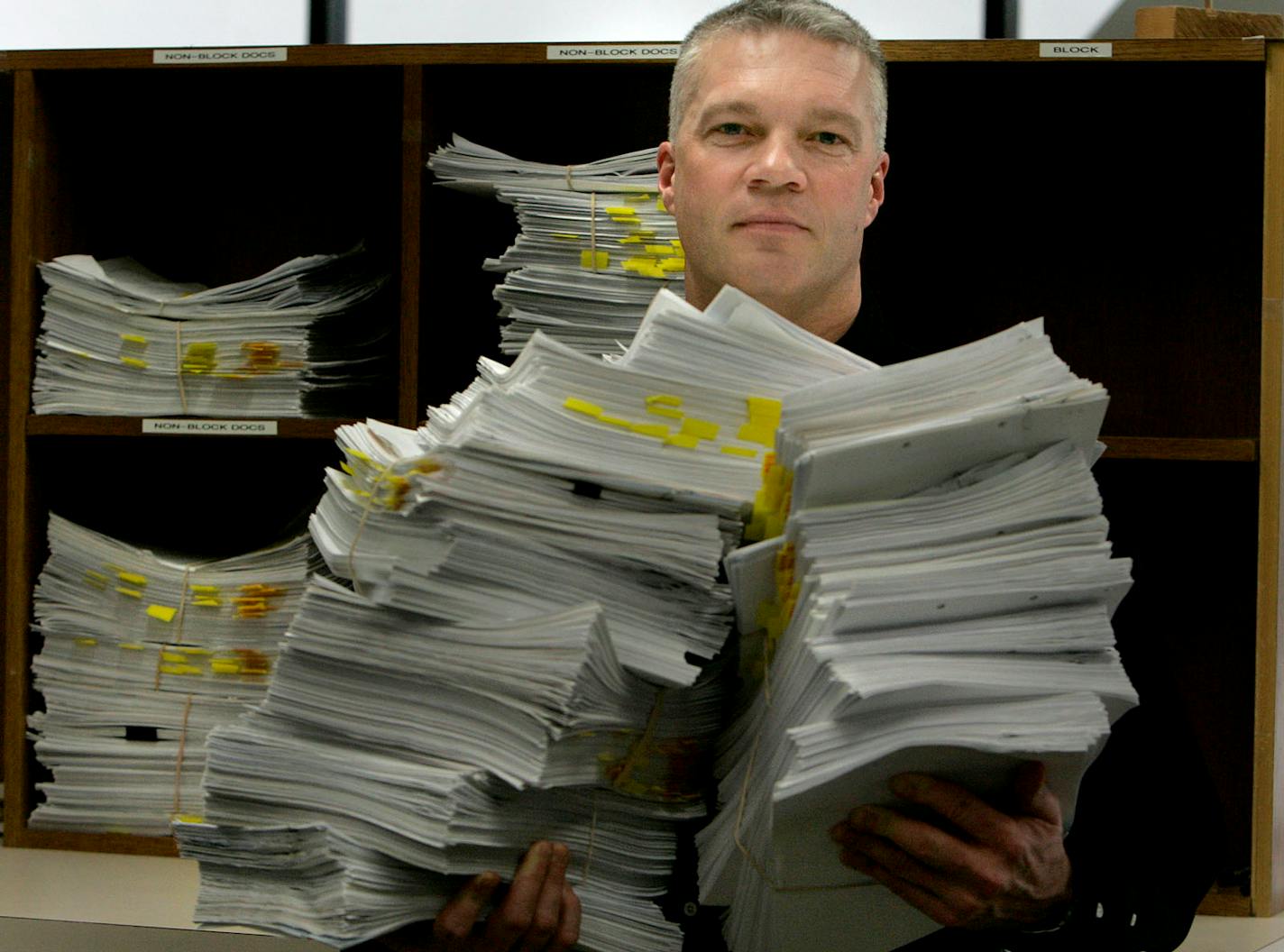 ELIZABETH FLORES � eflores@startribune.com February 22, 2008 - Minneapolis, MN - Mark S. Thompson, the Judicial District Administrator for the Fourth Judicial District, held onto the last six days worth of cases filed by attorneys seeking to collect unpaid credit card bills and other loans the public has defaulted on in Hennepin County. The county marked a 71% increase in 2007 over 2006.