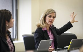 Jennifer DeCubellis sat in a "rapid huddle" meeting with other county staff to review where they're at in putting together Hennepin County's huge $13 