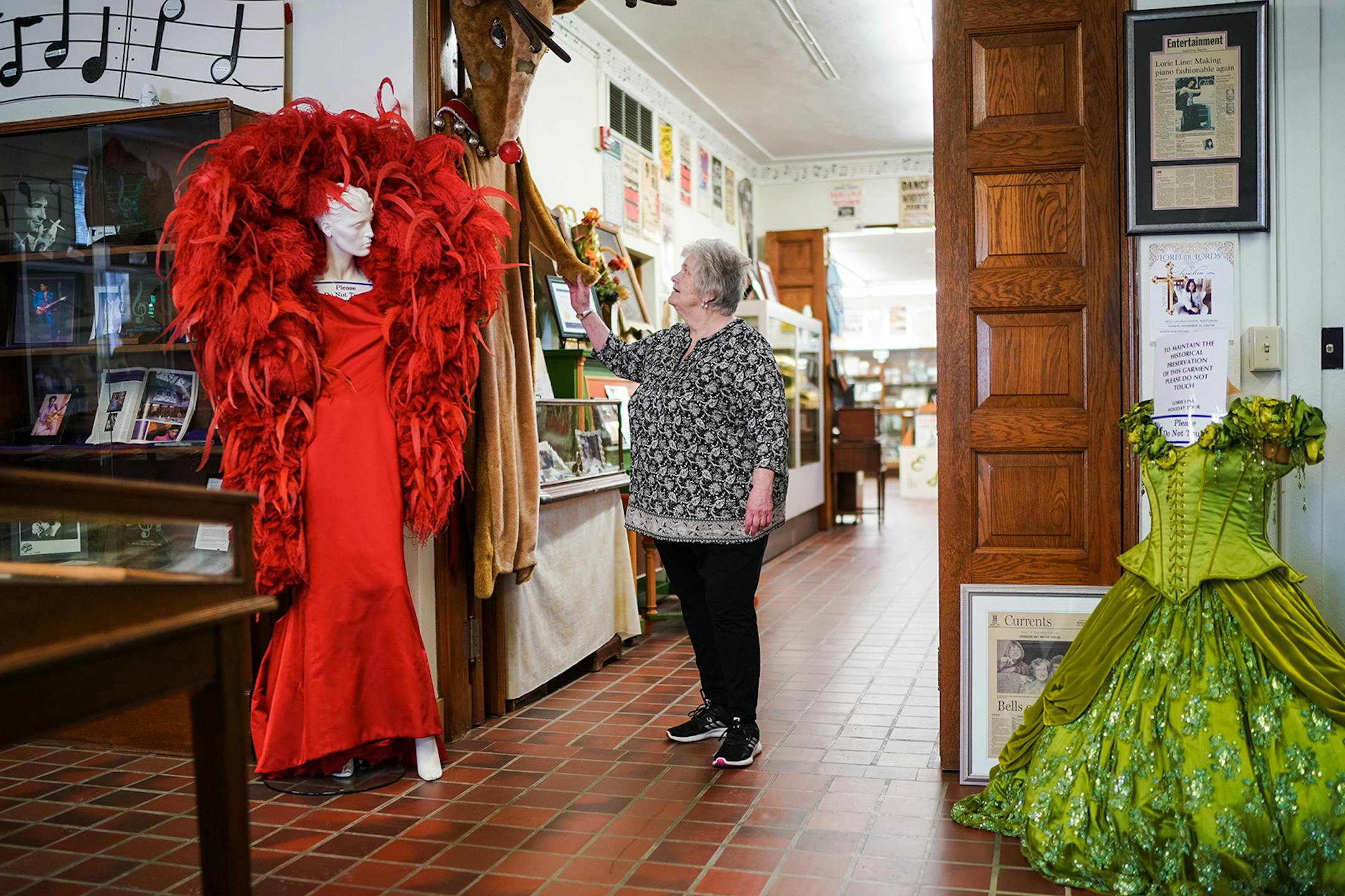 Bonnie Ubl, assistant director of the Minnesota Music Hall of Fame in New Ulm, Minnesota looked over some costumes from 2015 inductee Lorie Line.