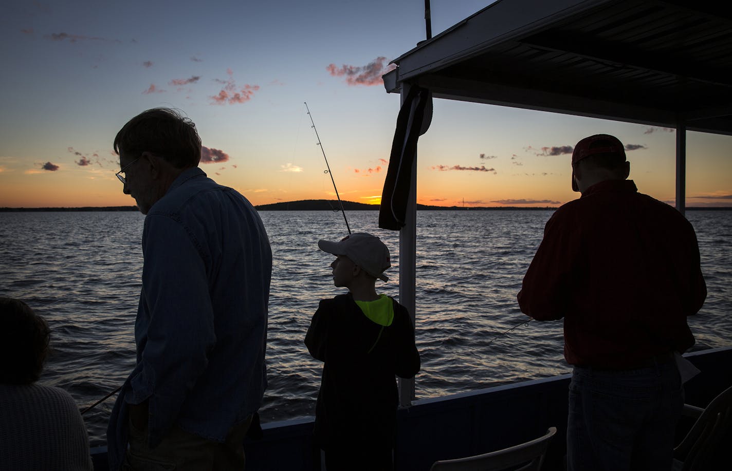 Customers fish during a fishing expedition with Twin Pines Resort on Mille Lacs Lake Monday, August 3, 2015. ] LEILA NAVIDI leila.navidi@startribune.com / ORG XMIT: MIN1508032200120277