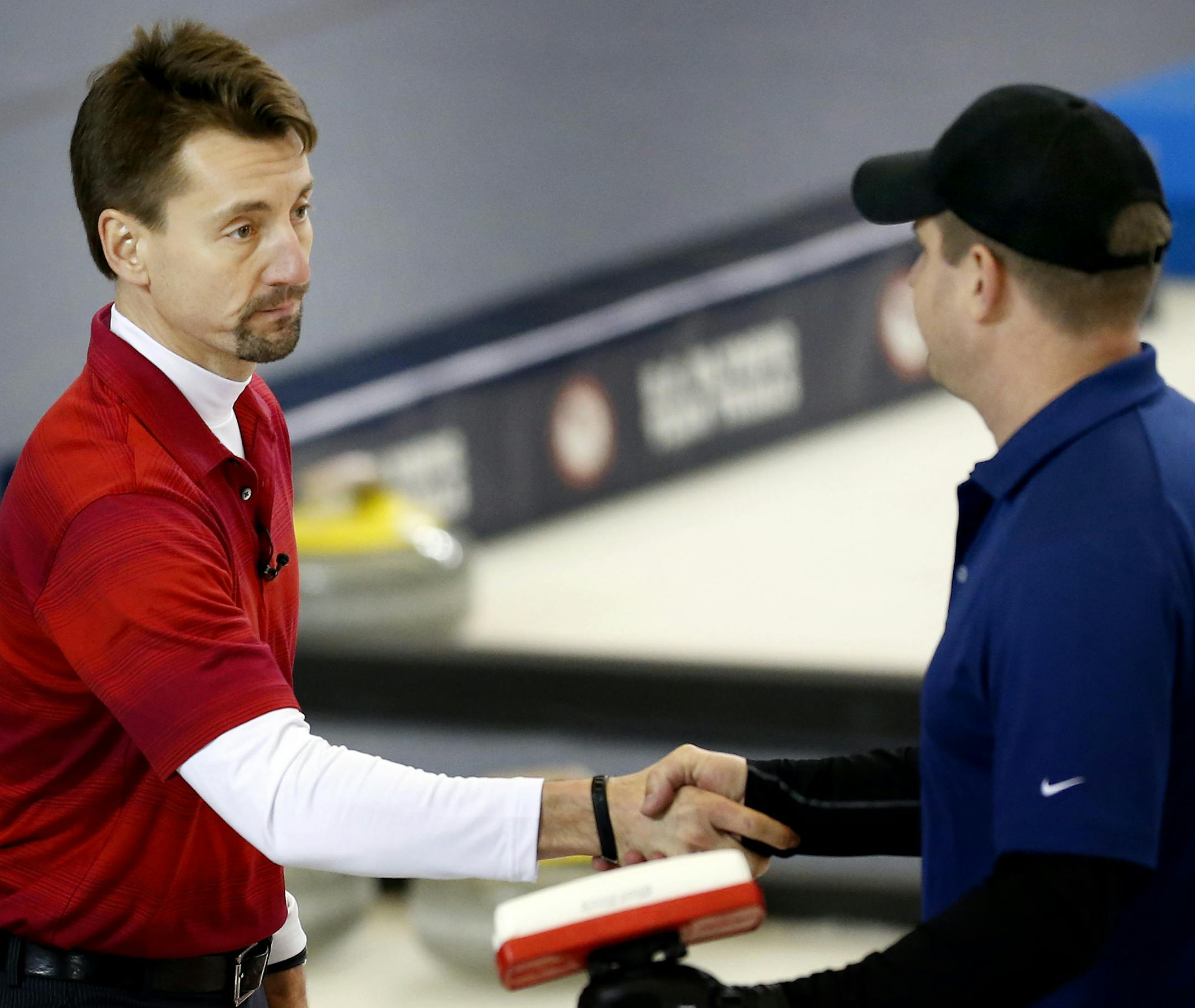Team skips Pete Fenson and John Shuster shook hands at the end. Team Shuster won the Gold Medal at the U.S. Olympic Team Trials for Curling on Sunday at The Scheels Arena in Fargo, ND. ] CARLOS GONZALEZ cgonzalez@startribune.com - November 17, 2013, Fargo, ND, Scheels Arena, U.S. Olympic Team Trials for Curling, Road To Sochi