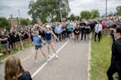 Gabriele Grunewald's running teammate Ladia Albertsonb-Junkans, left, and sister Abigail Anderson danced before family, friends, and supporters ran in
