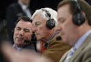 Bob Knight, center, works during ESPN's coverage during the second half of the championship game between Stanford and Miami at the NIT college basketb
