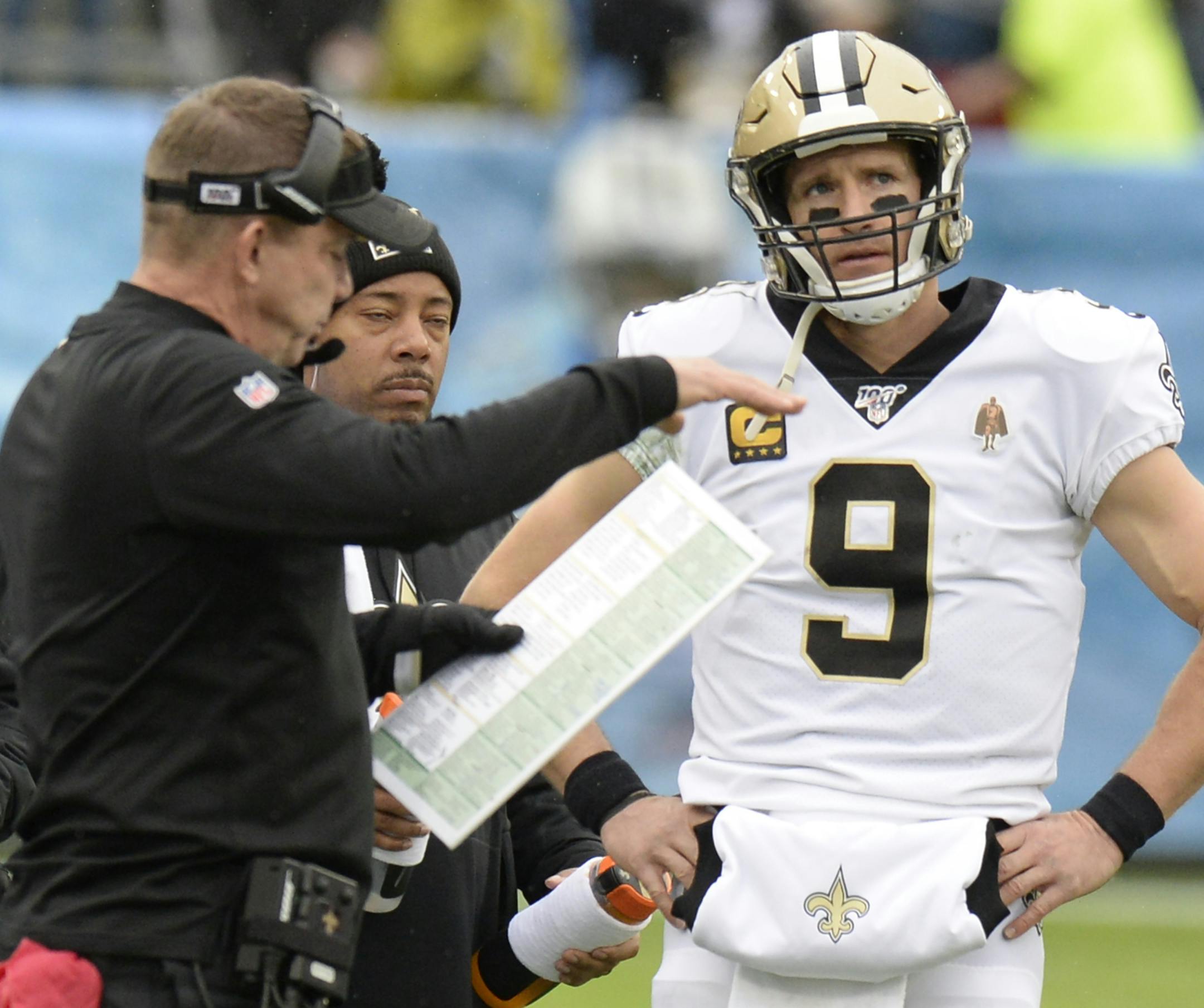 New Orleans Saints quarterback Drew Brees (9) talks with head coach Sean Payton in the first half of an NFL football game against the Tennessee Titans Sunday, Dec. 22, 2019, in Nashville, Tenn. (AP Photo/Mark Zaleski)