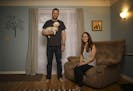 Anthony and Amy Ongaro with their dog, Rocky, in their south Minneapolis home. .