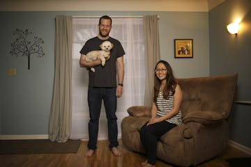 Anthony and Amy Ongaro with their dog, Rocky, in their south Minneapolis home. .