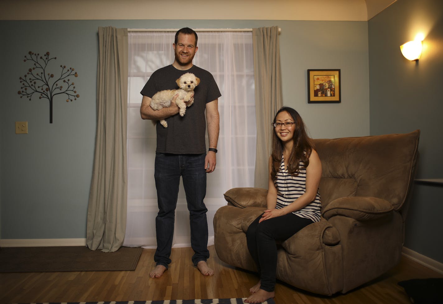 Anthony and Amy Ongaro with their dog, Rocky, in their south Minneapolis home. .