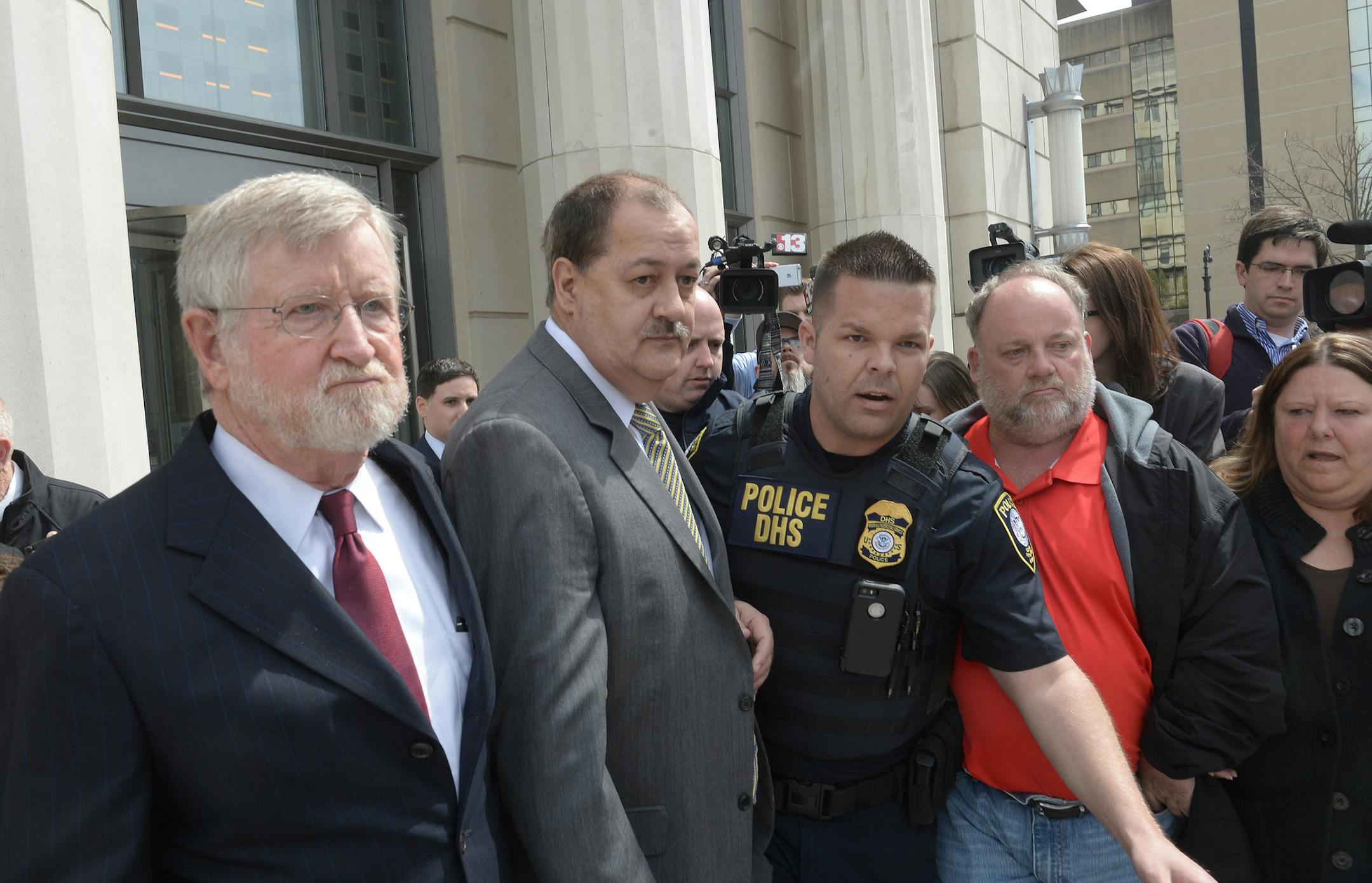 Former Massey Energy CEO Don Blankenship, second left, makes his way across out of the Robert C. Byrd Federal Courthouse after his sentencing on Wednesday, April 6, 2016, in Charleston, W.Va. U.S. District Judge Irene Berger gave the ex-Massey Energy CEO the maximum prison time and fine of $250,000. A federal jury convicted Blankenship on Dec. 3 of a misdemeanor conspiracy to violate mine safety standards at Upper Big Branch. (F. Brian Ferguson/The Gazette-Mail via AP)
