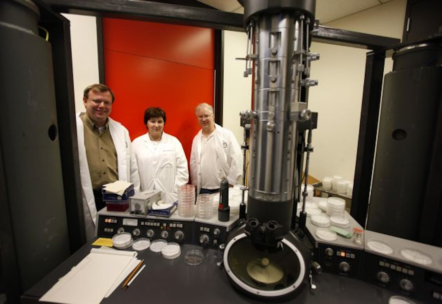 Researchers Louis Mansky, left, Christine Clouser and Steven Patterson collaborated at the University of Minnesota to study cancer drugs already on the market and see if they could be enlisted to fight HIV.