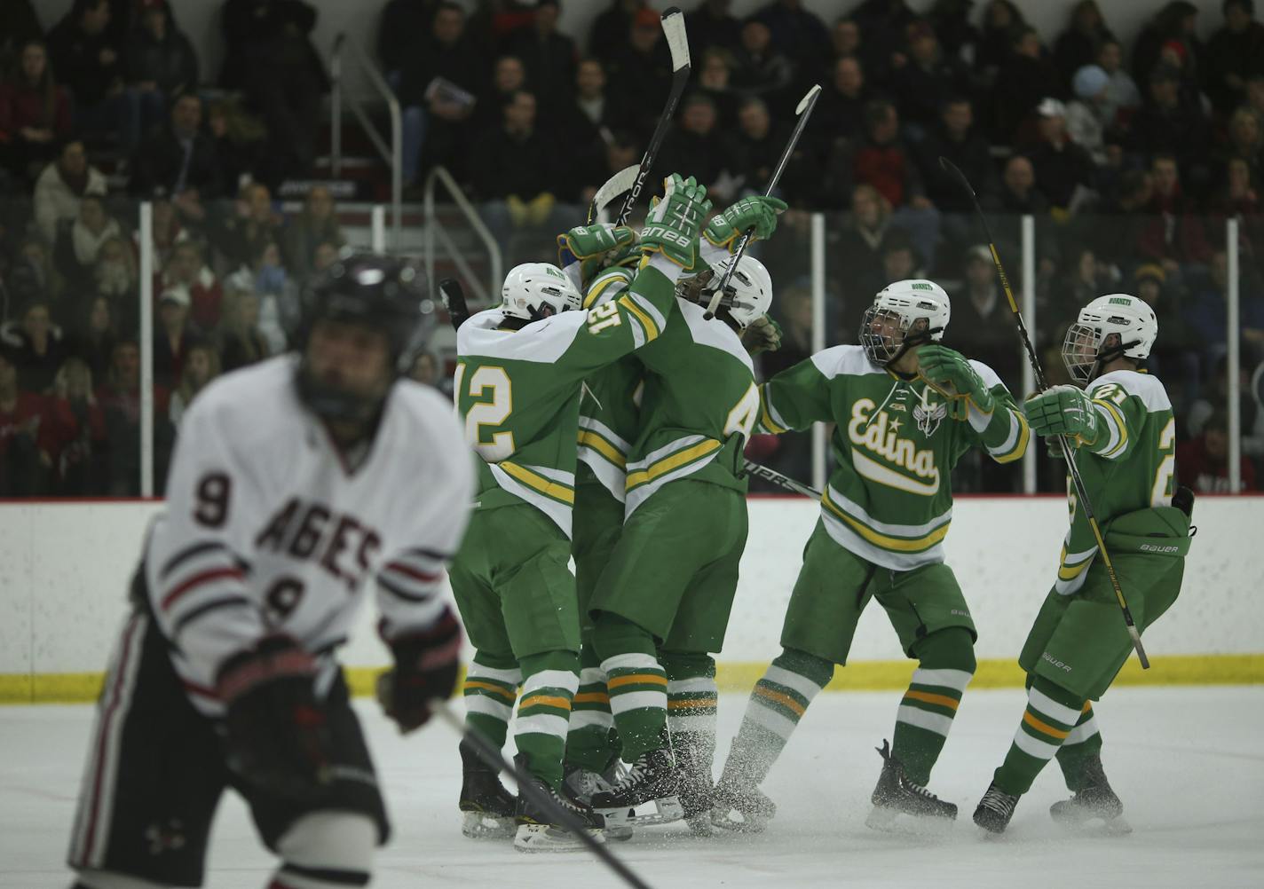 The Edina and Eden Prairie high schools boy's hockey teams met in a game Thursday night, January 31, 2013 at the Eden Prairie Community Center. Teammates converged on Edina's Dan Hinueber after he scored his team's second goal in the first period Thursday night. ] JEFF WHEELER &#x201a;&#xc4;&#xa2; jeff.wheeler@startribune.com ORG XMIT: MIN1301312149173355