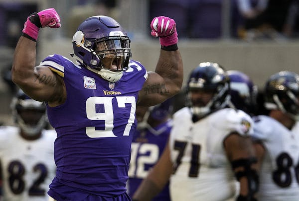 Everson Griffen (97) celebrated after he stripped the ball from Joe Flacco in the fourth quarter. ] CARLOS GONZALEZ &#xef; cgonzalez@startribune.com -