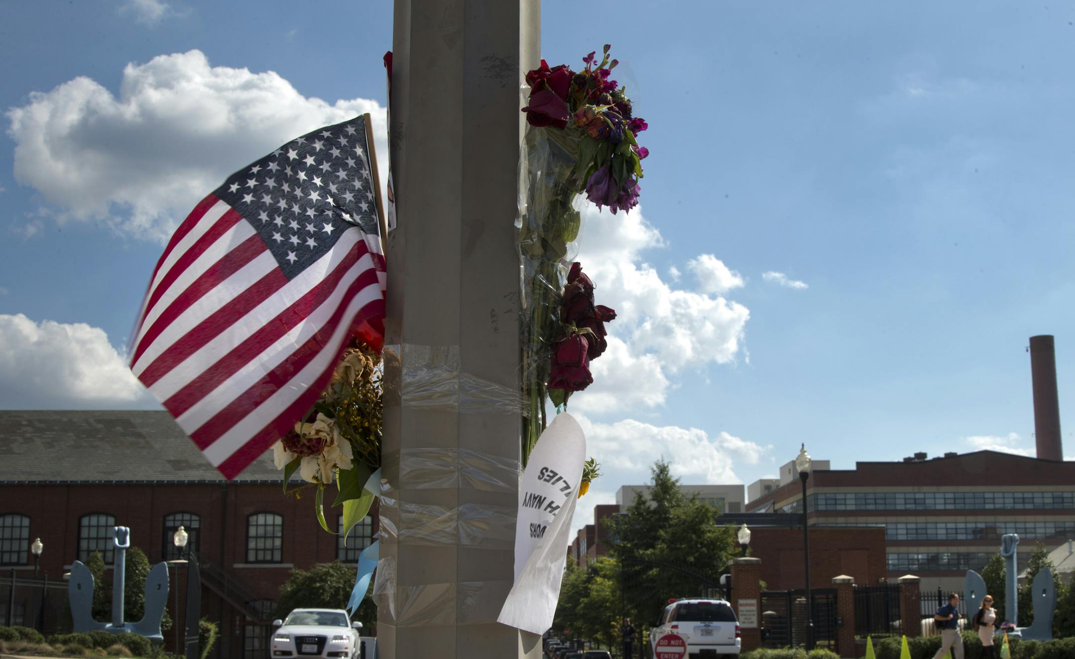 A makeshift memorial hangs on a lamp post across the street from the Washington Navy Yard, Friday, Sept. 20, 2013, in Washington. A gunman killed 12 people in the Navy Yard on Monday, Sept. 16, 2013, before being fatally shot in a gun battle with law enforcement. (AP Photo/Carolyn Kaster)