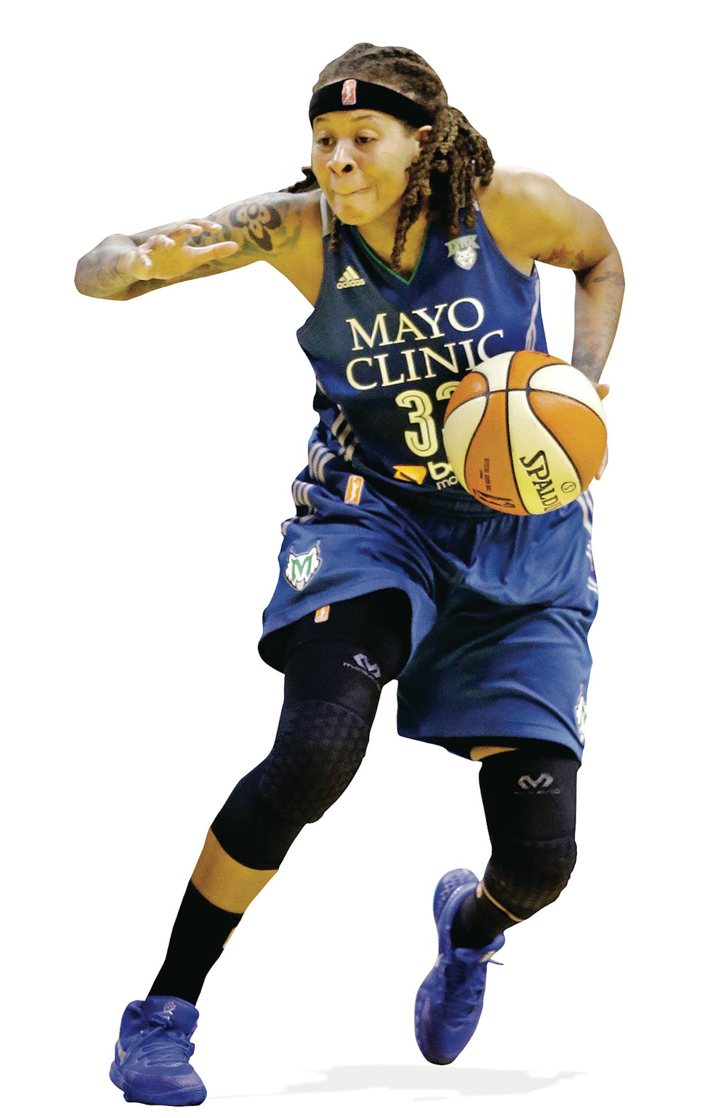 Minnesota Lynx's Seimone Augustus, right, tries to drive around Indiana Fever's Natasha Howard in the second half of Game 4 of the WNBA Finals basketball series, in Indianapolis, Sunday, Oct. 11, 2015. (AP Photo/Michael Conroy) ORG XMIT: NAF10