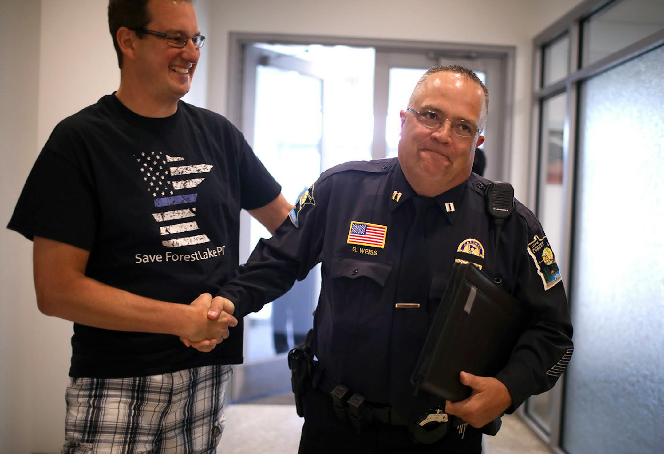 Brian Richert, whose brother Mark is a member of the Forest Lake Police Department, congratulated Police Capt. Greg Weiss on the labor agreement that had just been approved by the Forest Lake City Council moments earlier.