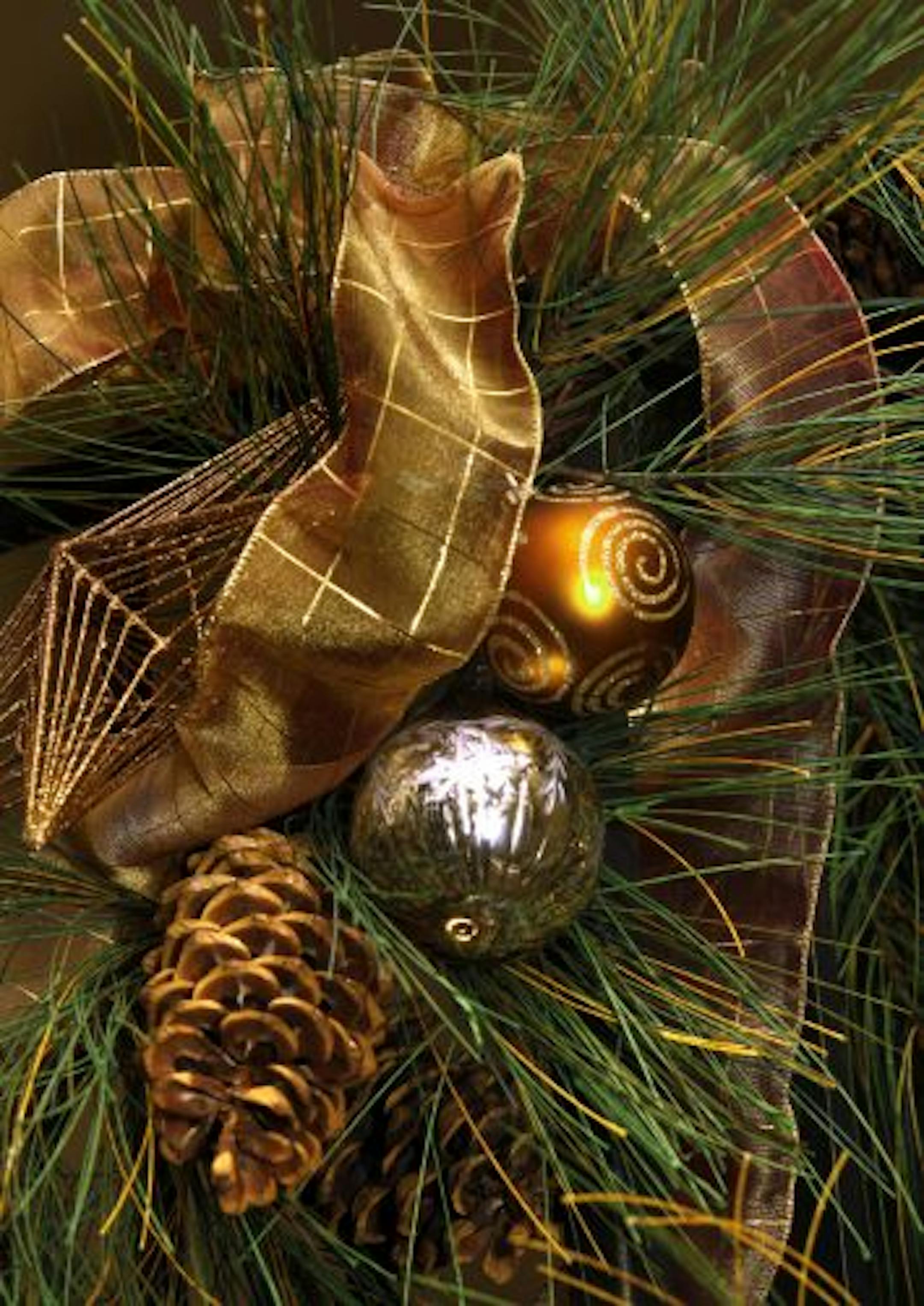 Railing garland is embellished with copper ribbon and mercury glass ornaments.