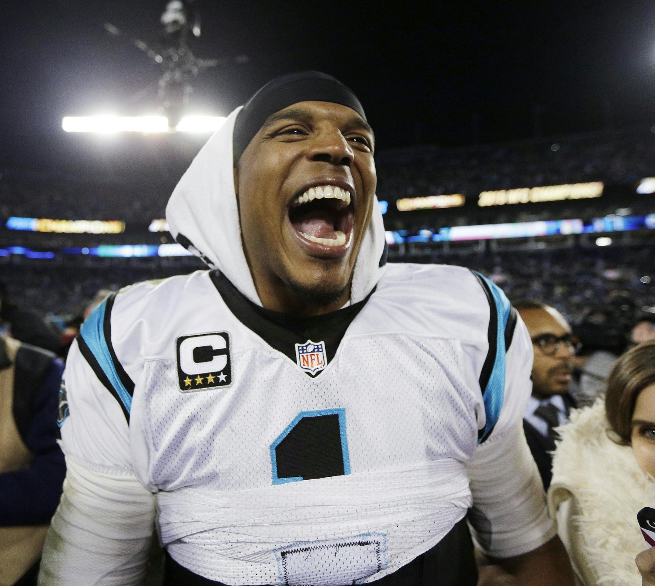 Carolina Panthers' Cam Newton celebrates after the NFL football NFC Championship game against the Arizona Cardinals, Sunday, Jan. 24, 2016, in Charlotte, N.C. The Panthers won 49-15 to advance to the Super Bowl. (AP Photo/Chuck Burton)