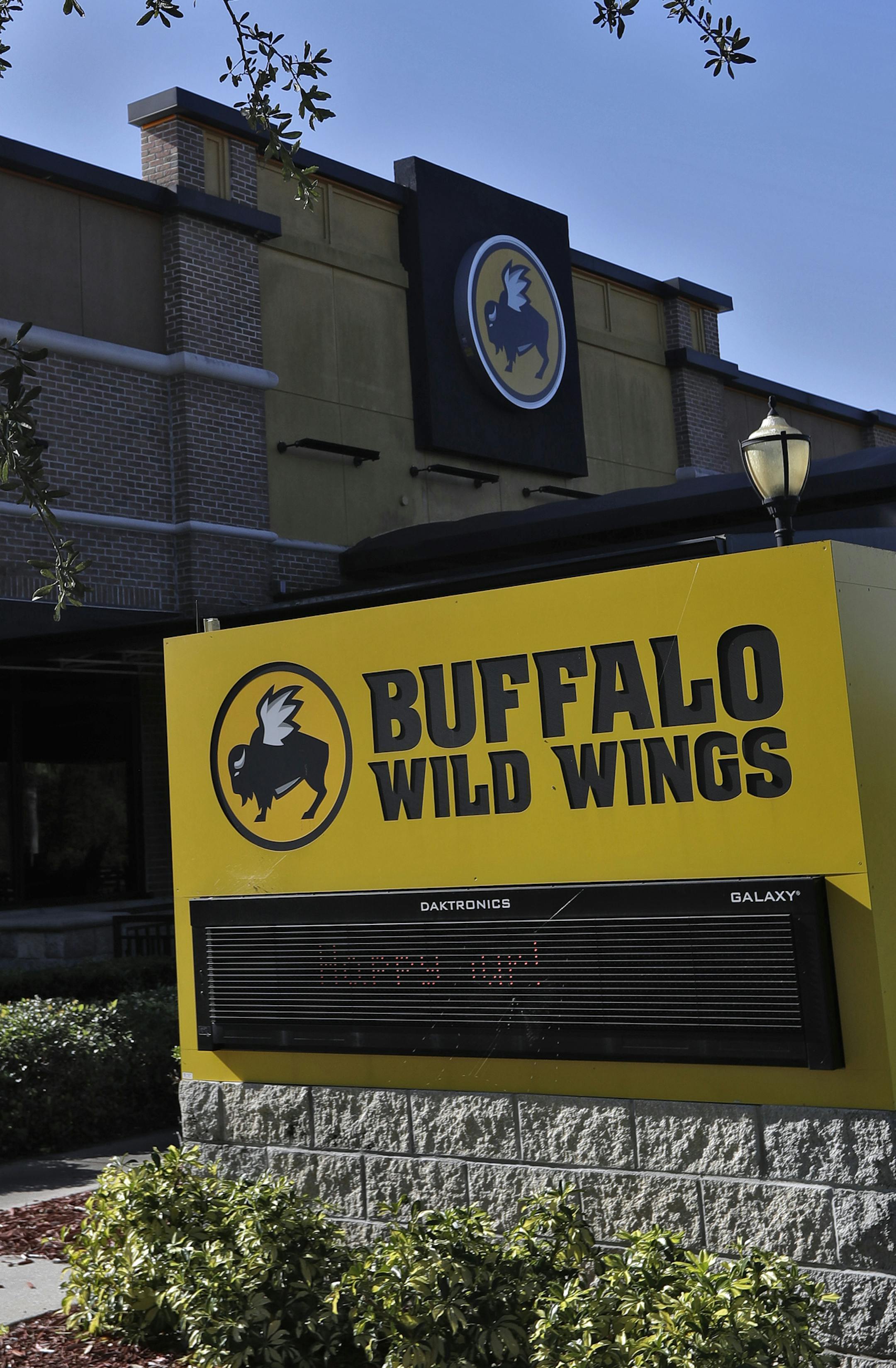 A Buffalo Wild Wings restaurant is shown Tuesday, Nov. 28, 2017, in Valrico, Fla. Fast food chain Arby's is buying Buffalo Wild Wings. The deal is expected to close in 2018's first quarter. It still needs the approval of Buffalo Wild Wings shareholders. (AP Photo/Chris O'Meara)