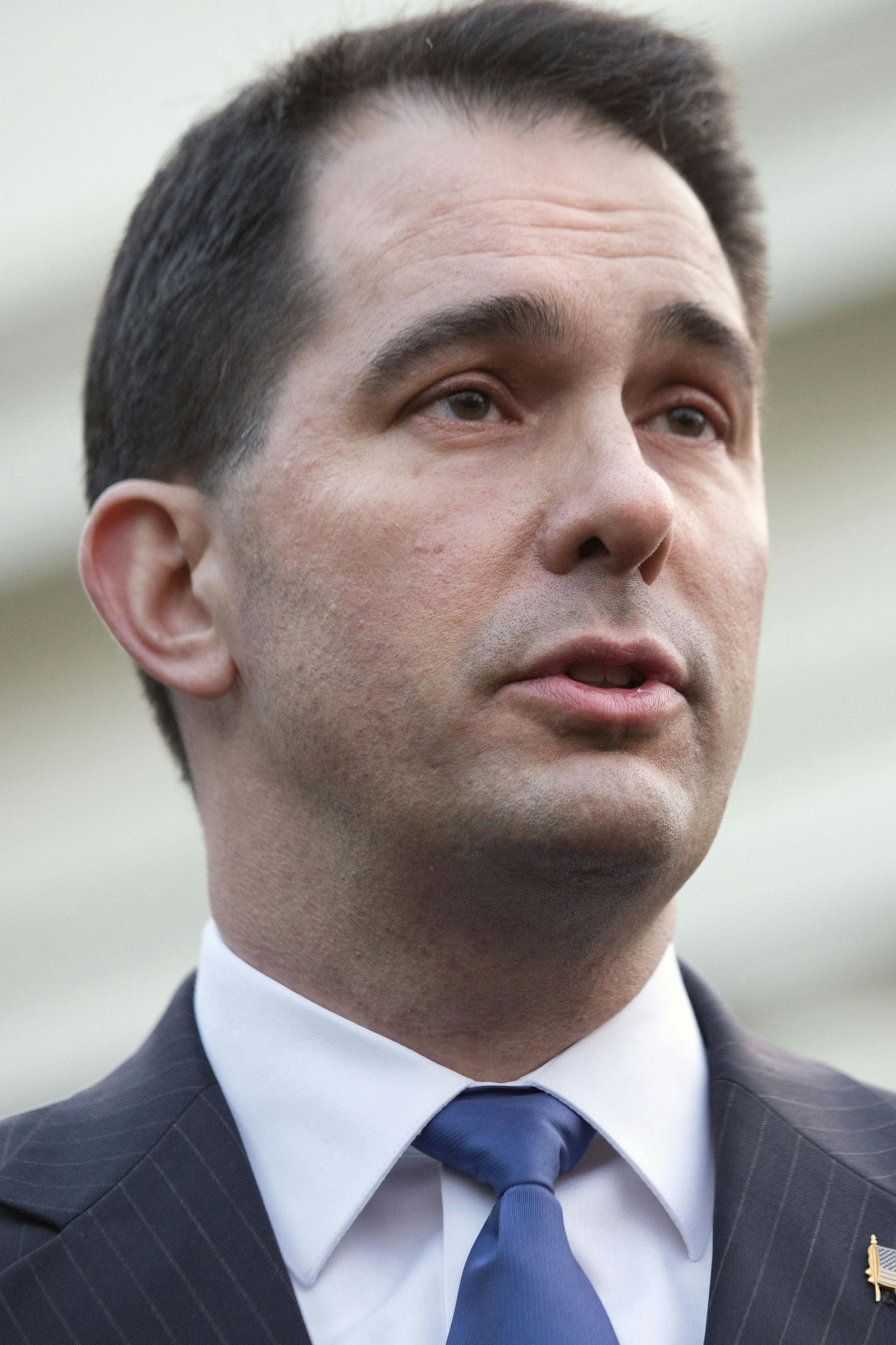 Wisconsin Gov. Scott Walker, a member of the executive committee of the National Governors Association, speaks to the media after meeting with President Barack Obama at the White House Tuesday, Jan. 14, 2014, in Washington. (AP Photo/Jacquelyn Martin)
