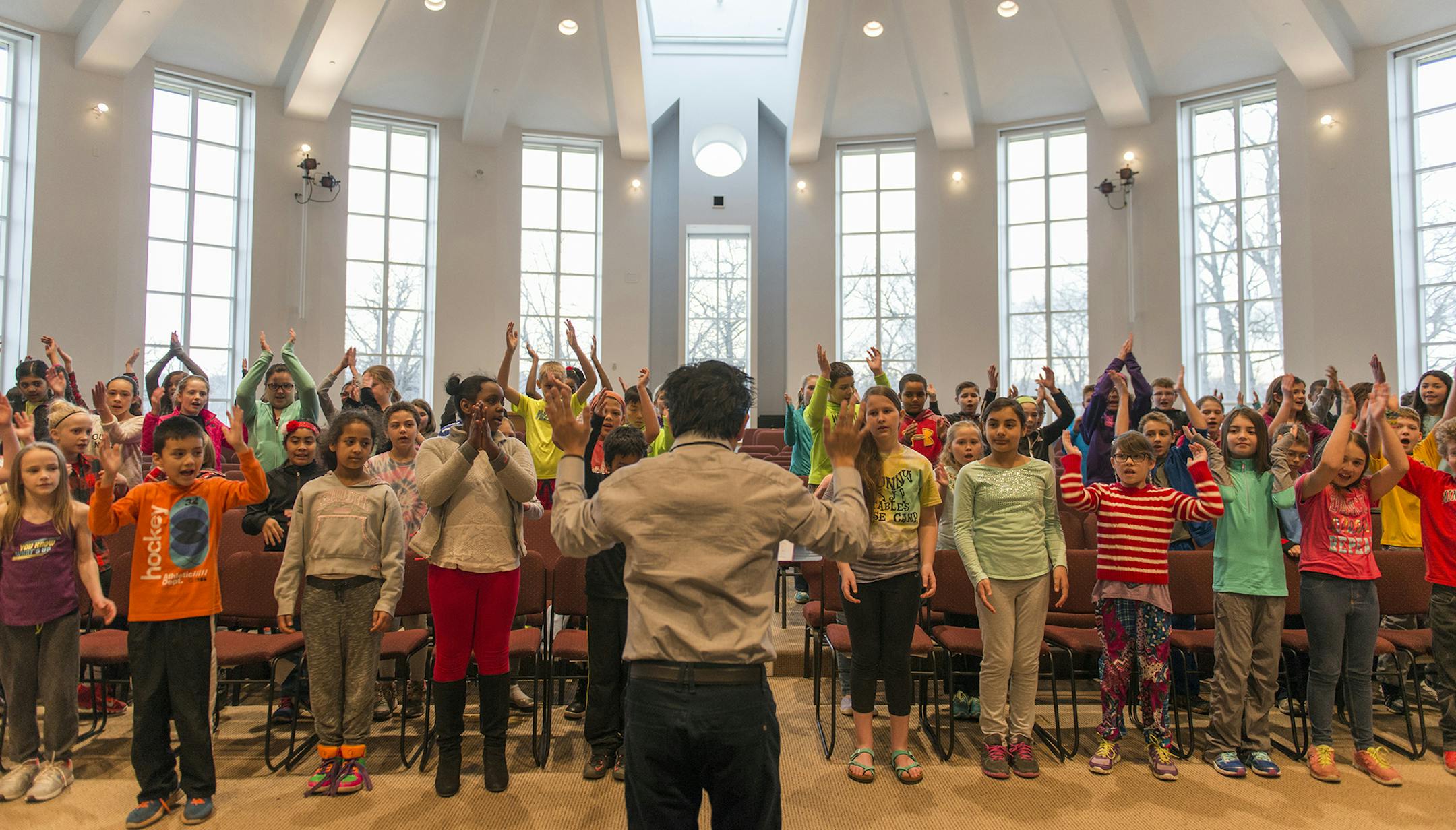 Jean Angelus Pichardo conducting the Youth Choir from Our Lady of Guadalupe Church. Photo Credit: Stephen Maturen