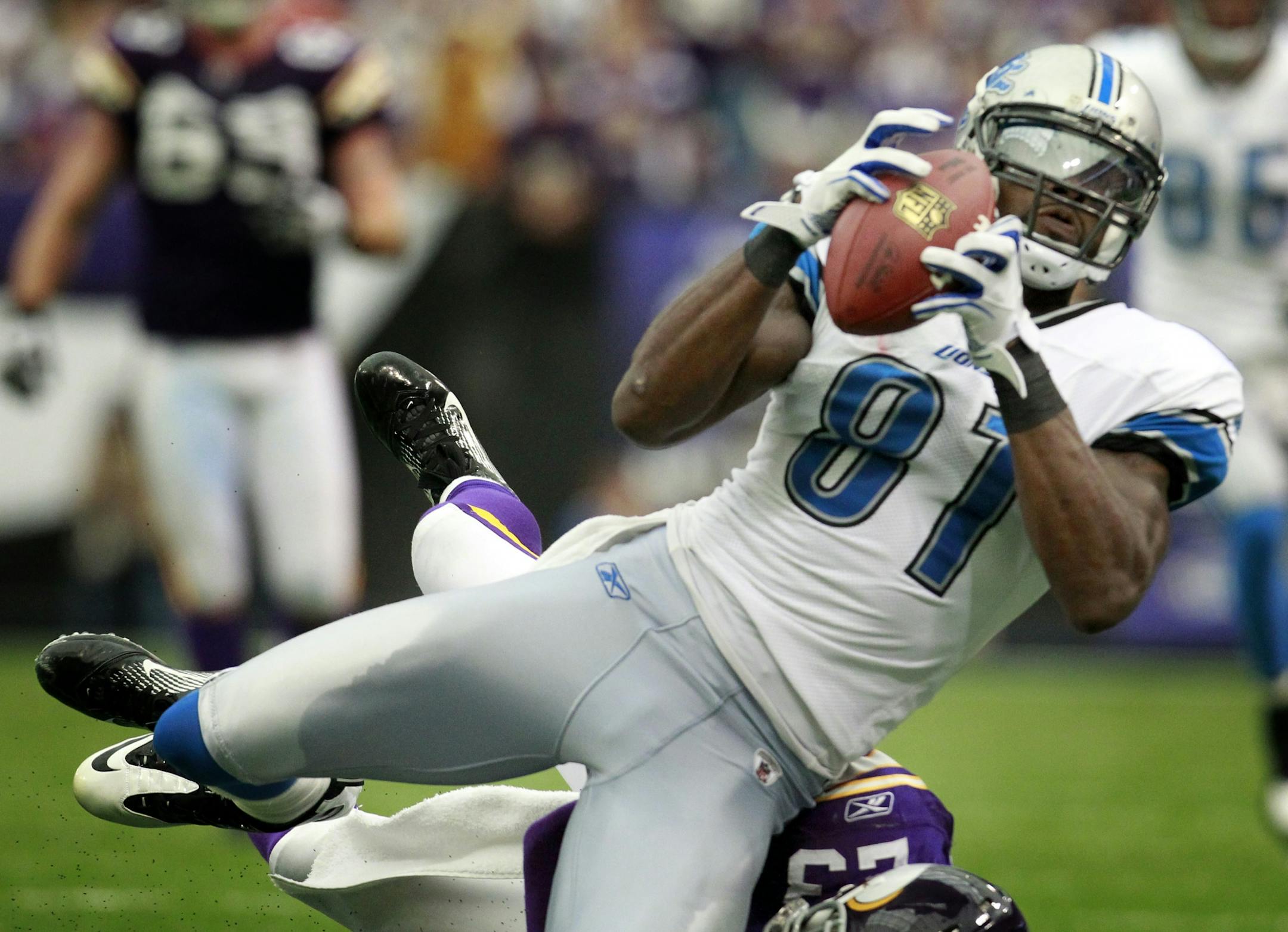 Lions wide receiver Calvin Johnson caught a 40-yard pass while being defended by Vikings cornerback Cedric Griffin in overtime, helping Detroit beat Minnesota 26-23.