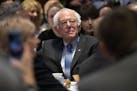 Democratic presidential candidate Sen. Bernie Sanders, I-Vt., listens as he is introduced during the Politics & Eggs at New Hampshire Institute of Pol